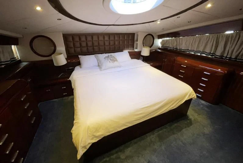 a bed in a room aboard L'OR Yacht for Sale