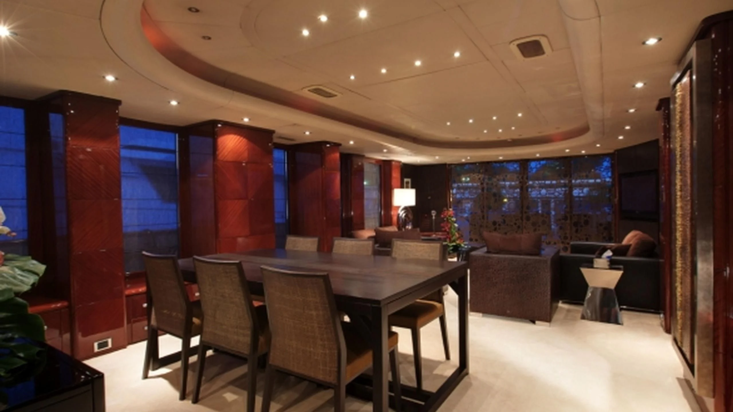 a room with a table and chairs aboard L'OR Yacht for Sale