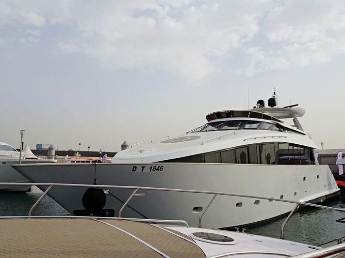 a white yacht docked aboard L'OR Yacht for Sale