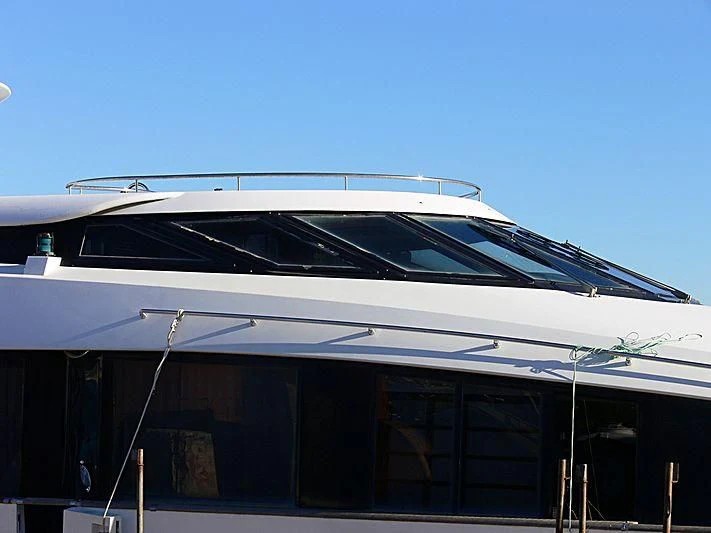 a white yacht on a dock aboard L'OR Yacht for Sale