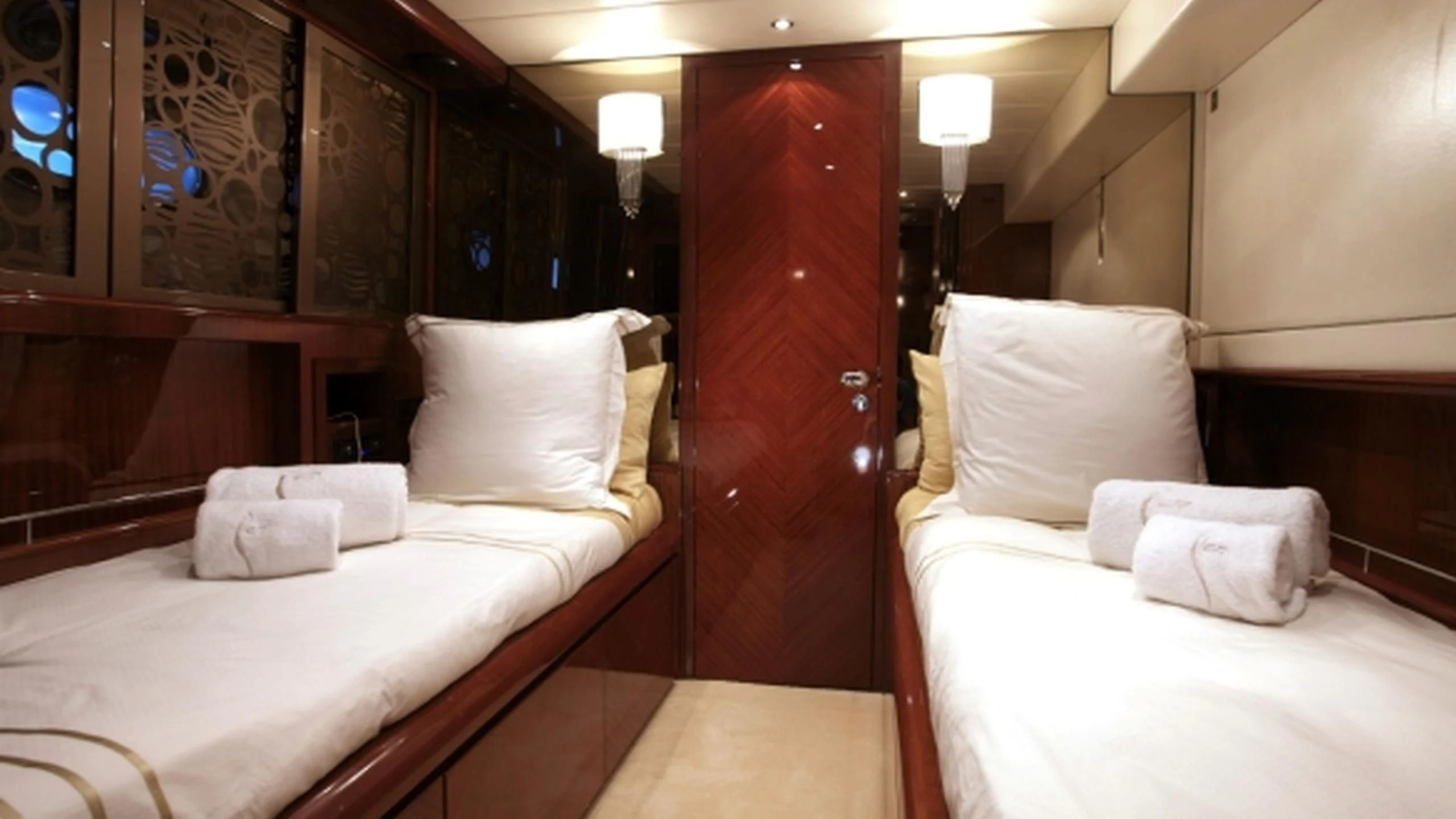 a room with two beds aboard L'OR Yacht for Sale
