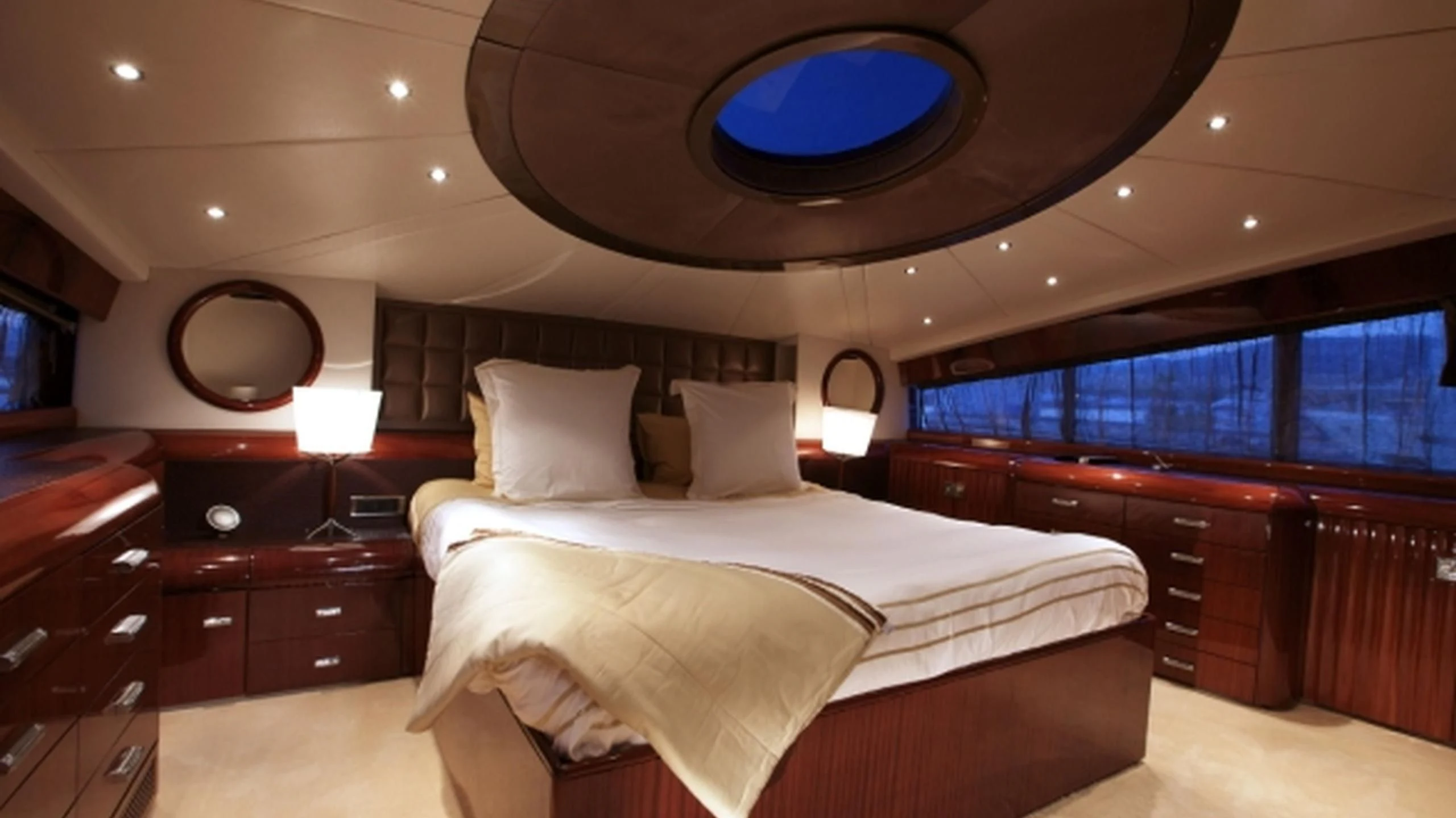a bedroom with a large bed aboard L'OR Yacht for Sale