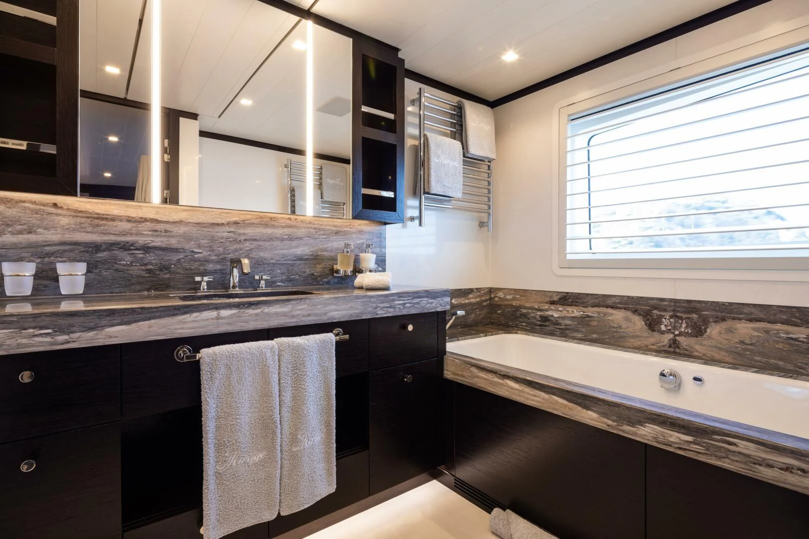a bathroom with a large countertop aboard MIRAGE Yacht for Sale