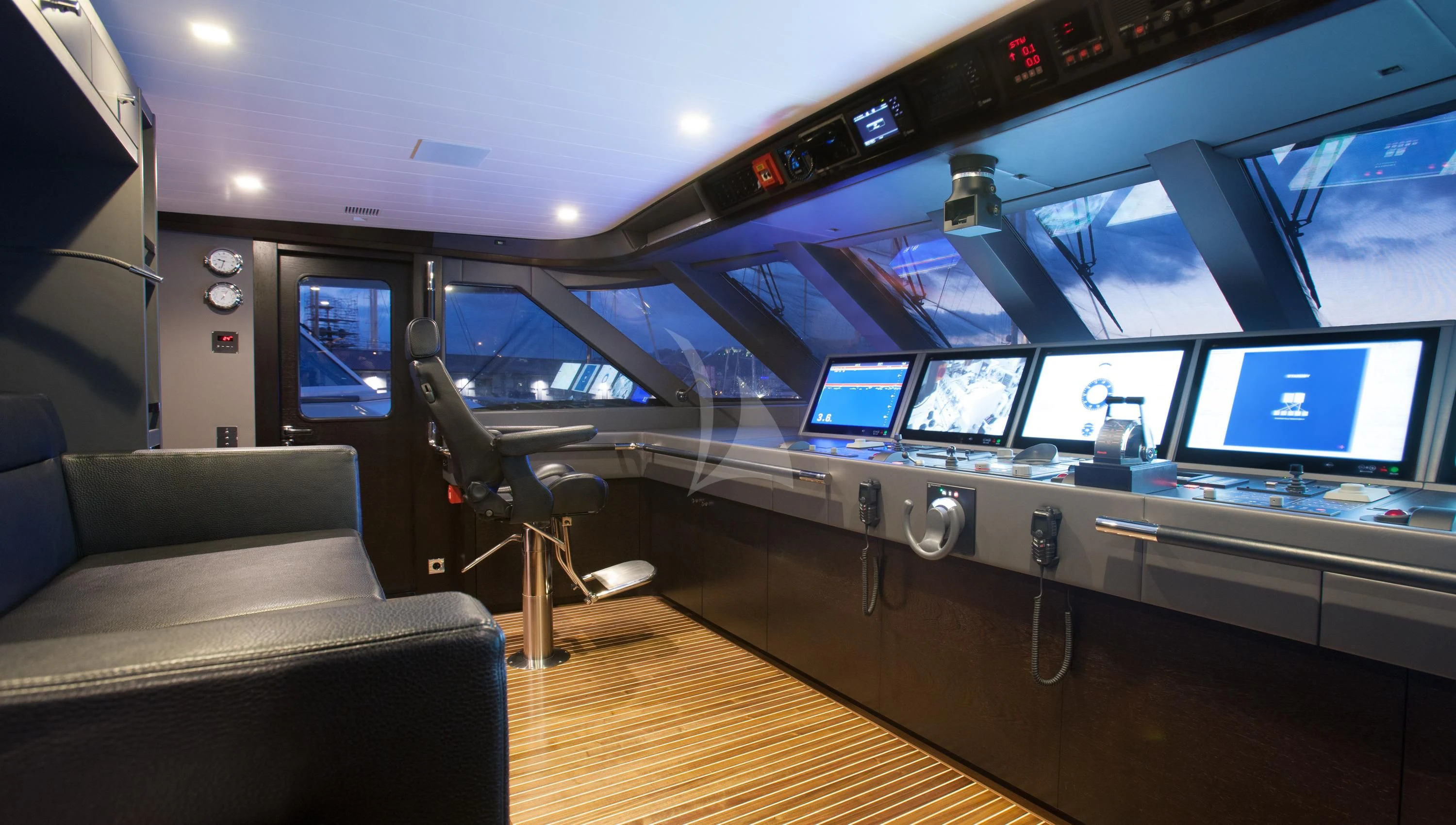 a room with a row of computers aboard MIRAGE Yacht for Sale