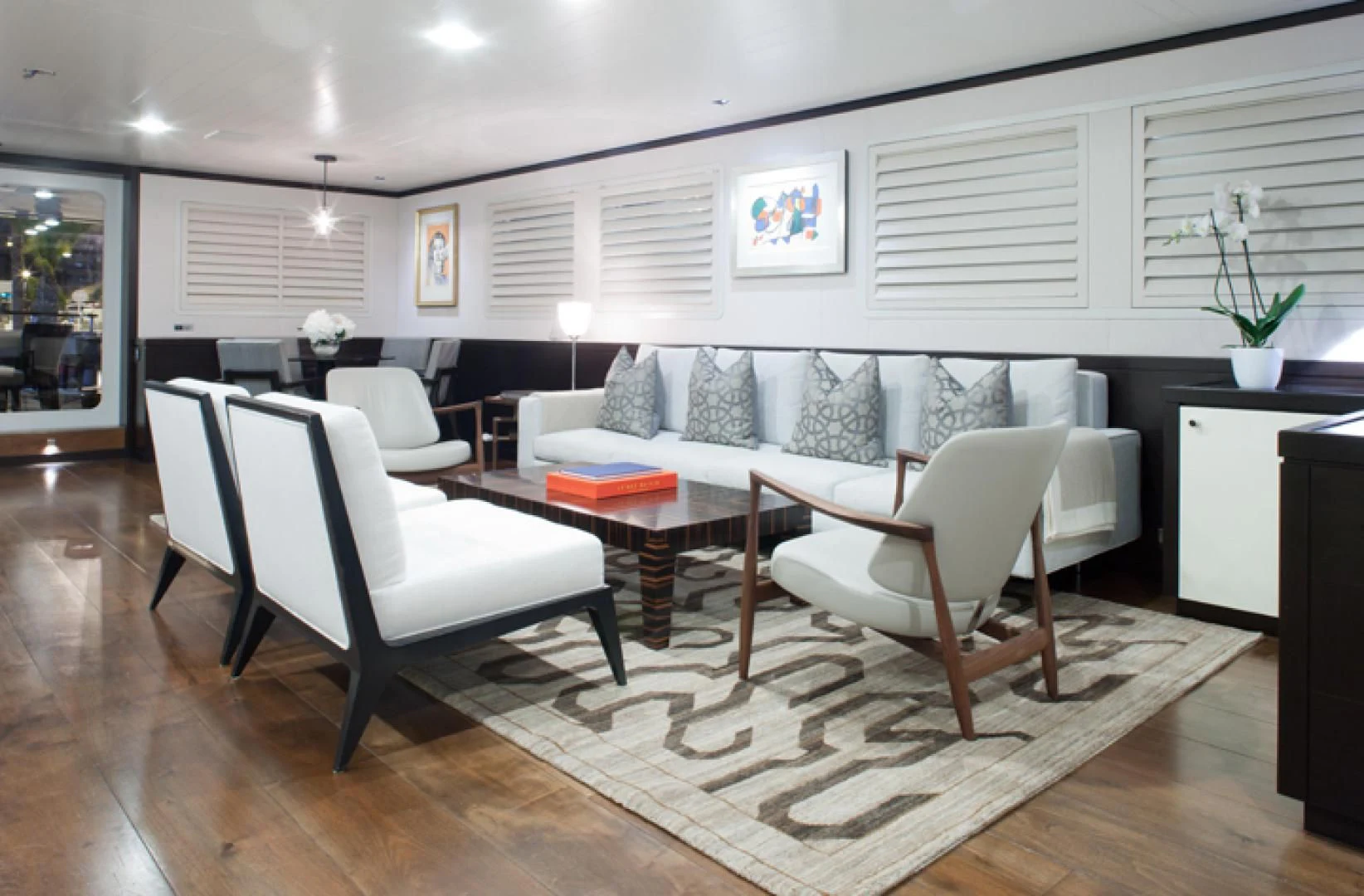 a living room with a couch and a table aboard MIRAGE Yacht for Sale