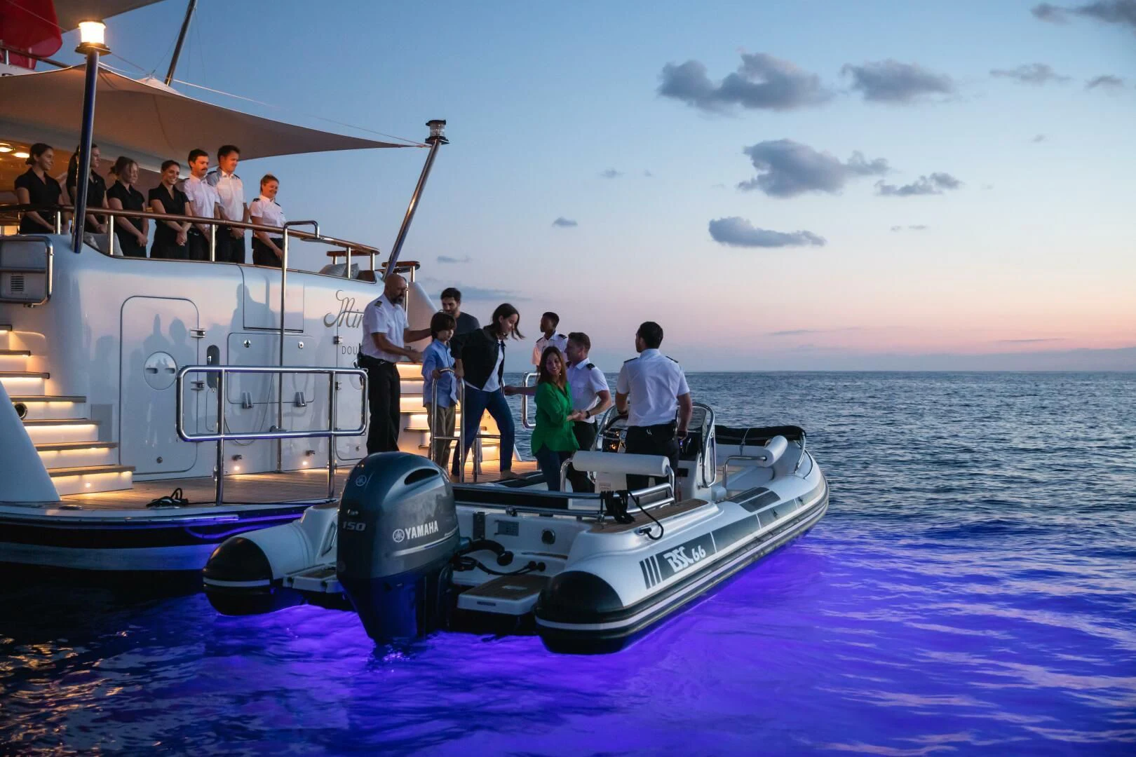 a group of people on a boat aboard MIRAGE Yacht for Sale