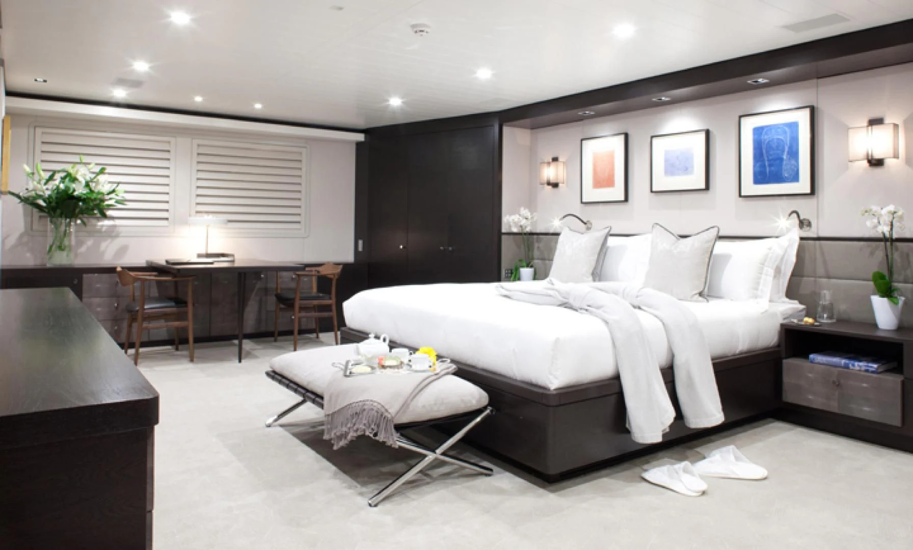 a large bedroom with a large bed aboard MIRAGE Yacht for Sale