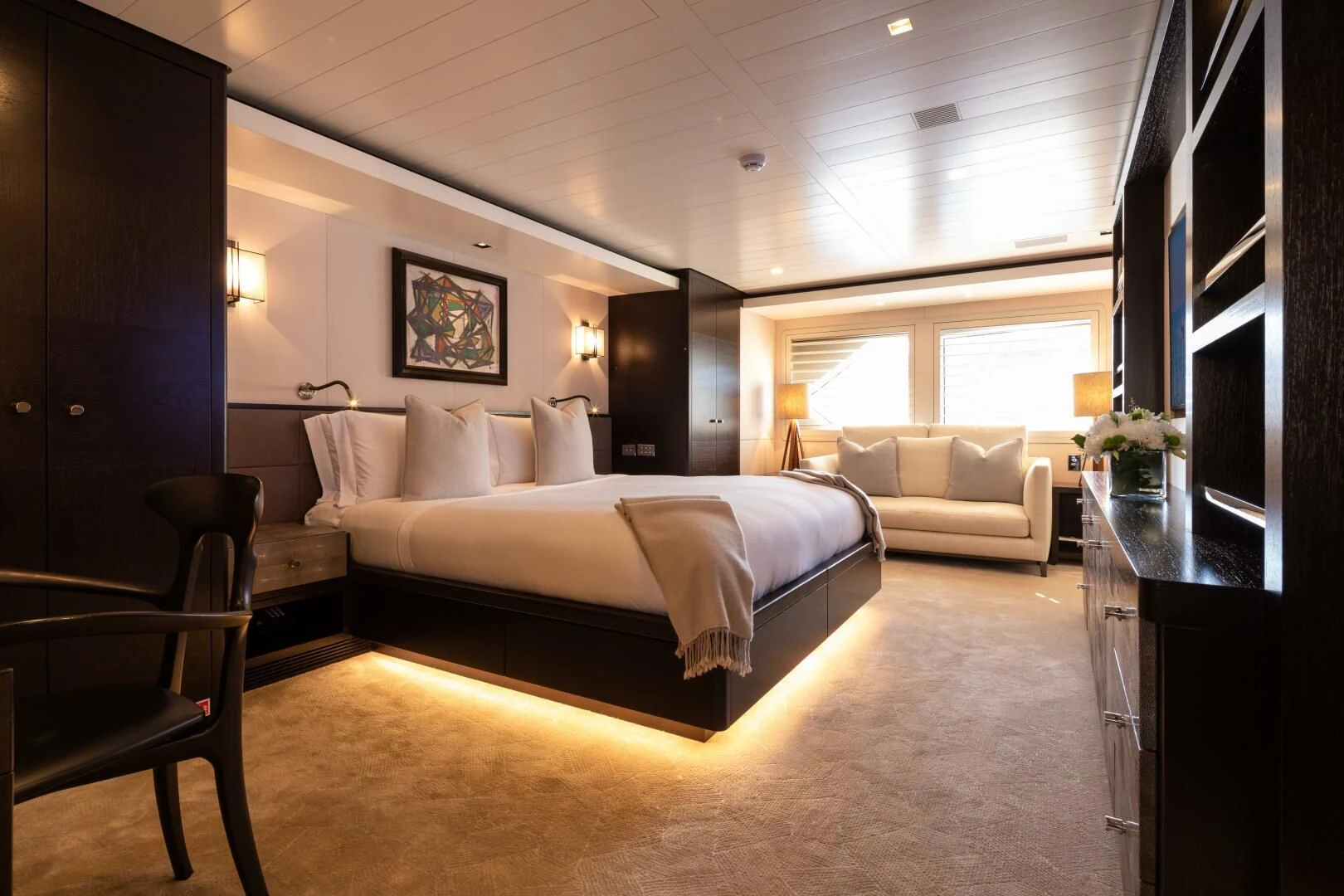 a large bedroom with a bed and a tv aboard MIRAGE Yacht for Sale