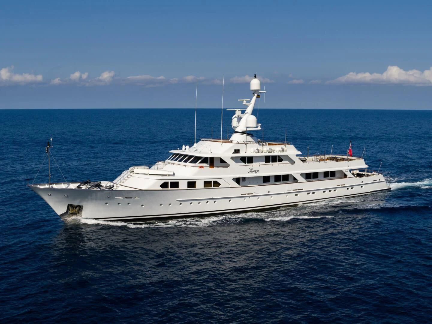 a white yacht in the water aboard MIRAGE Yacht for Sale