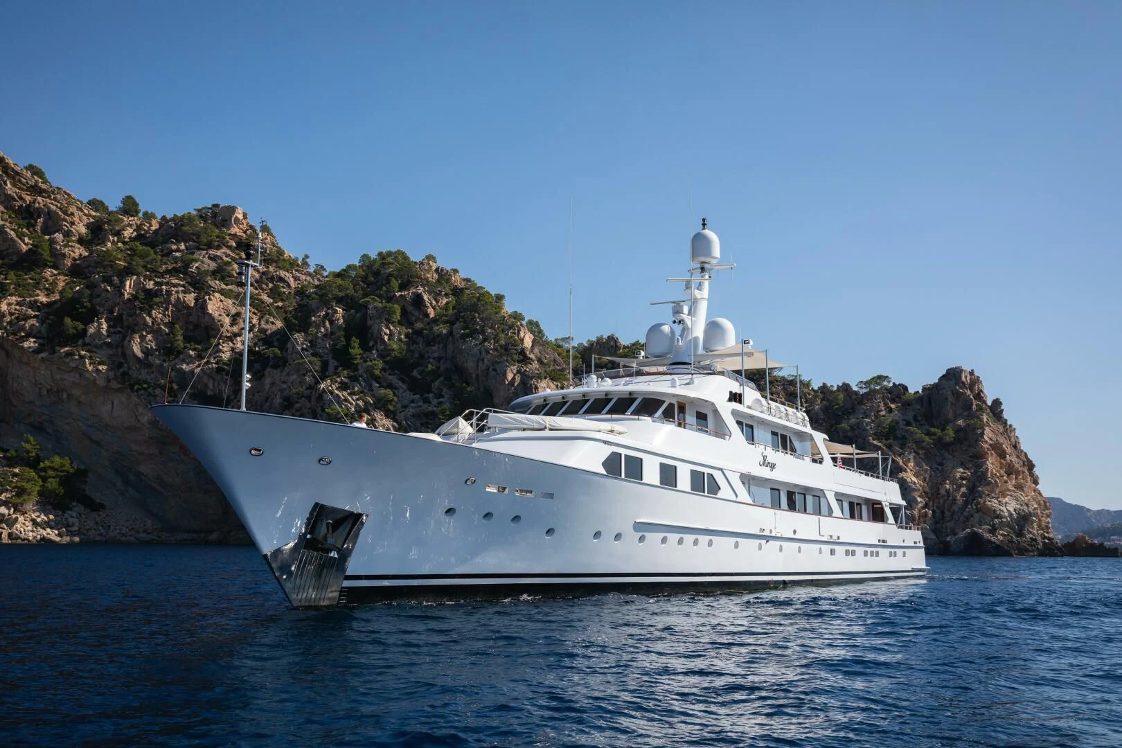 a white yacht on the water aboard MIRAGE Yacht for Sale