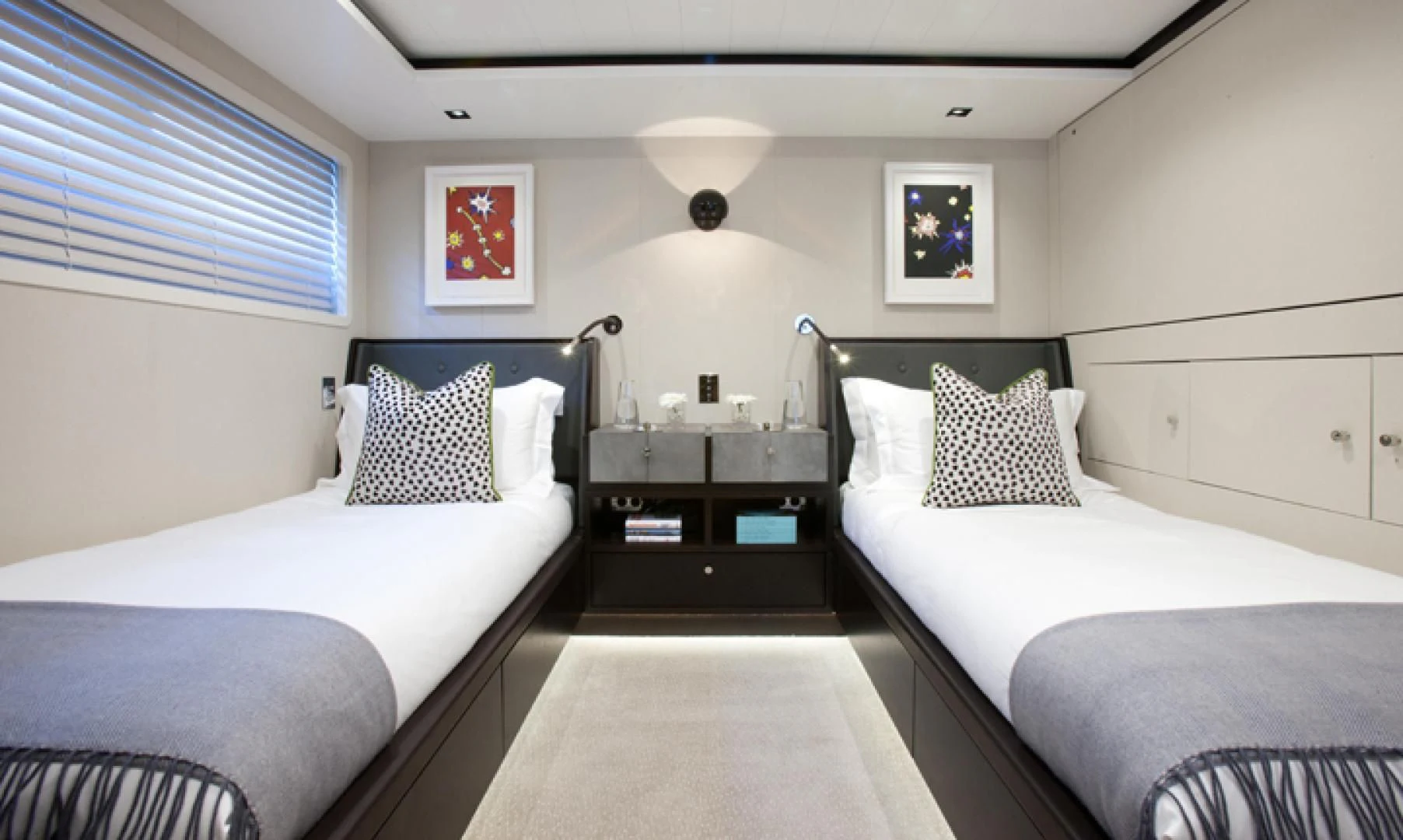 a couple of beds in a room aboard MIRAGE Yacht for Sale