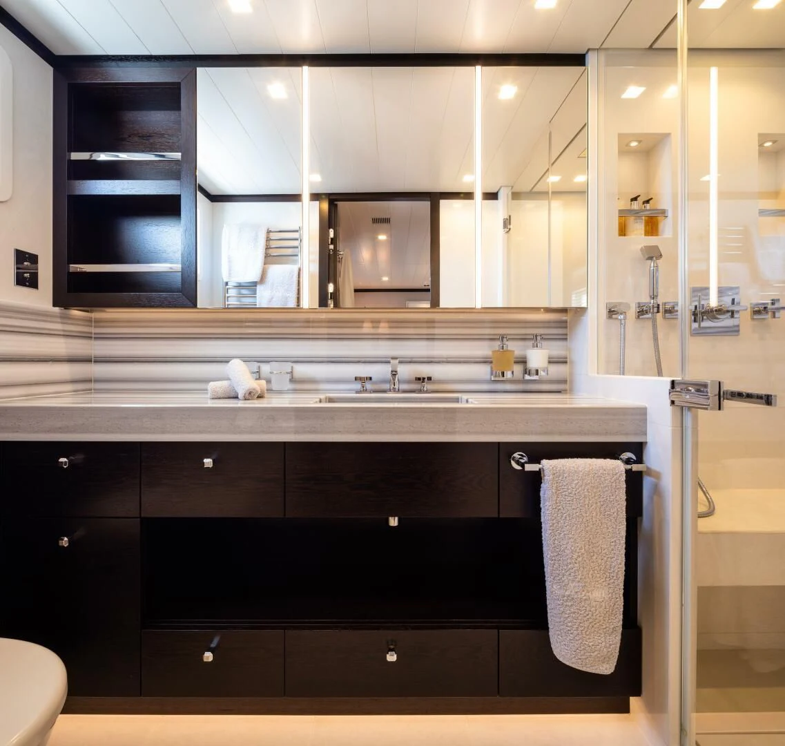 a bathroom with a glass shower aboard MIRAGE Yacht for Sale