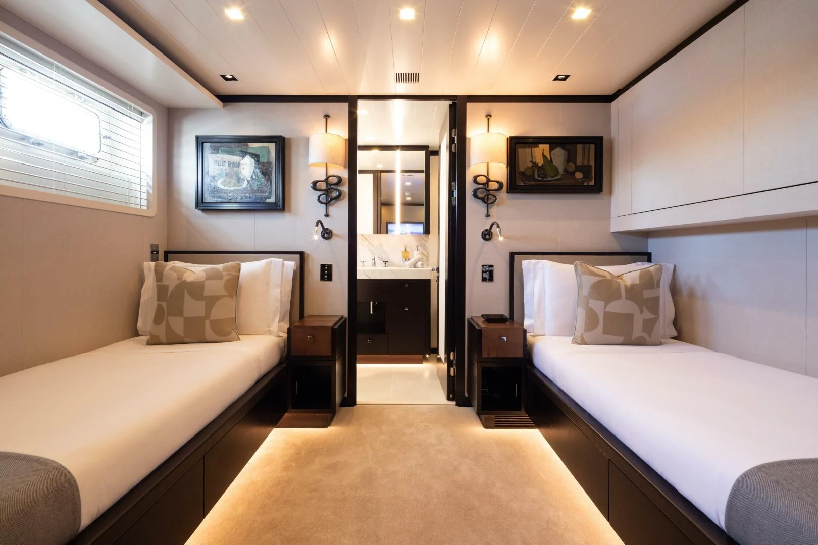 a room with two beds aboard MIRAGE Yacht for Sale
