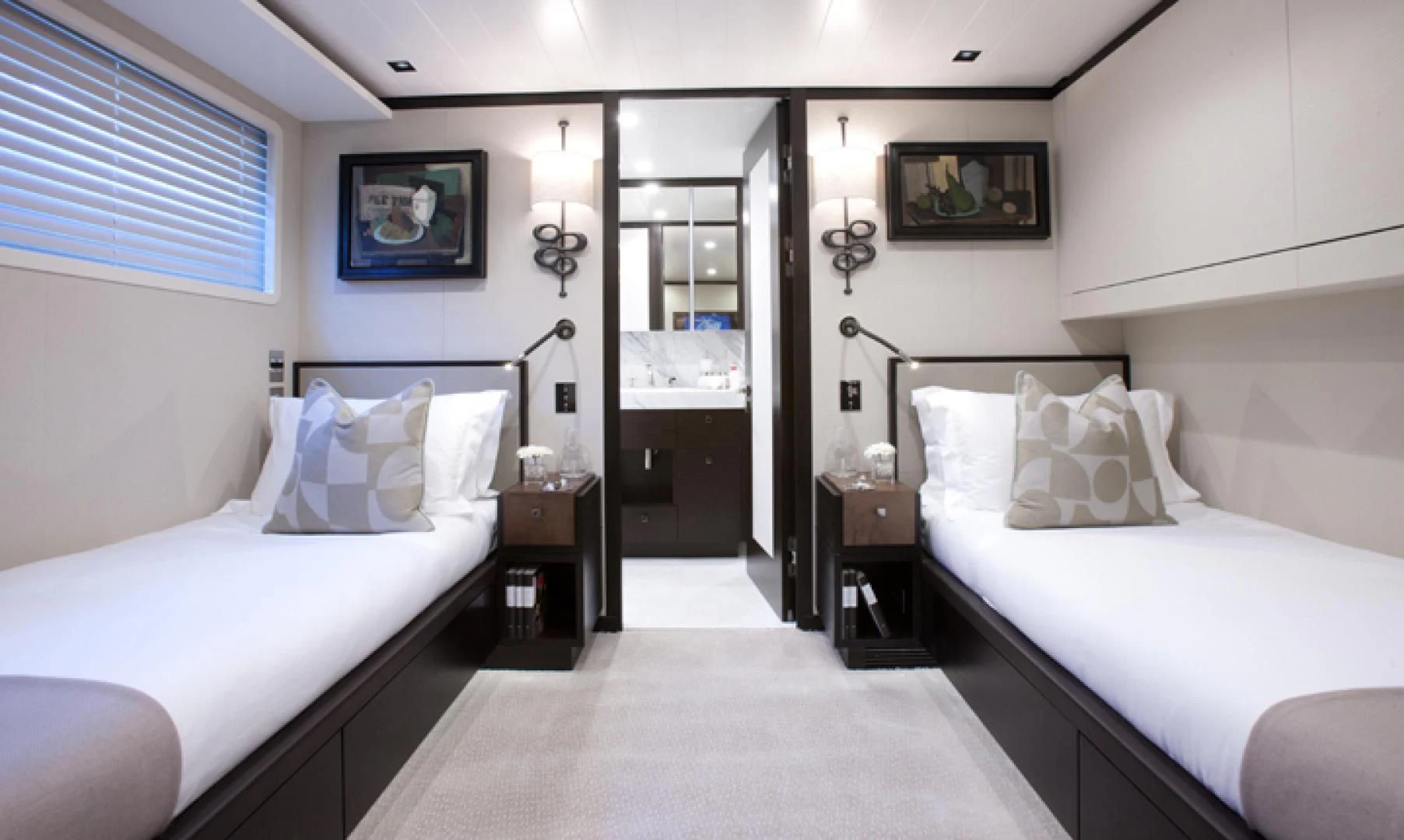 a room with two beds aboard MIRAGE Yacht for Sale