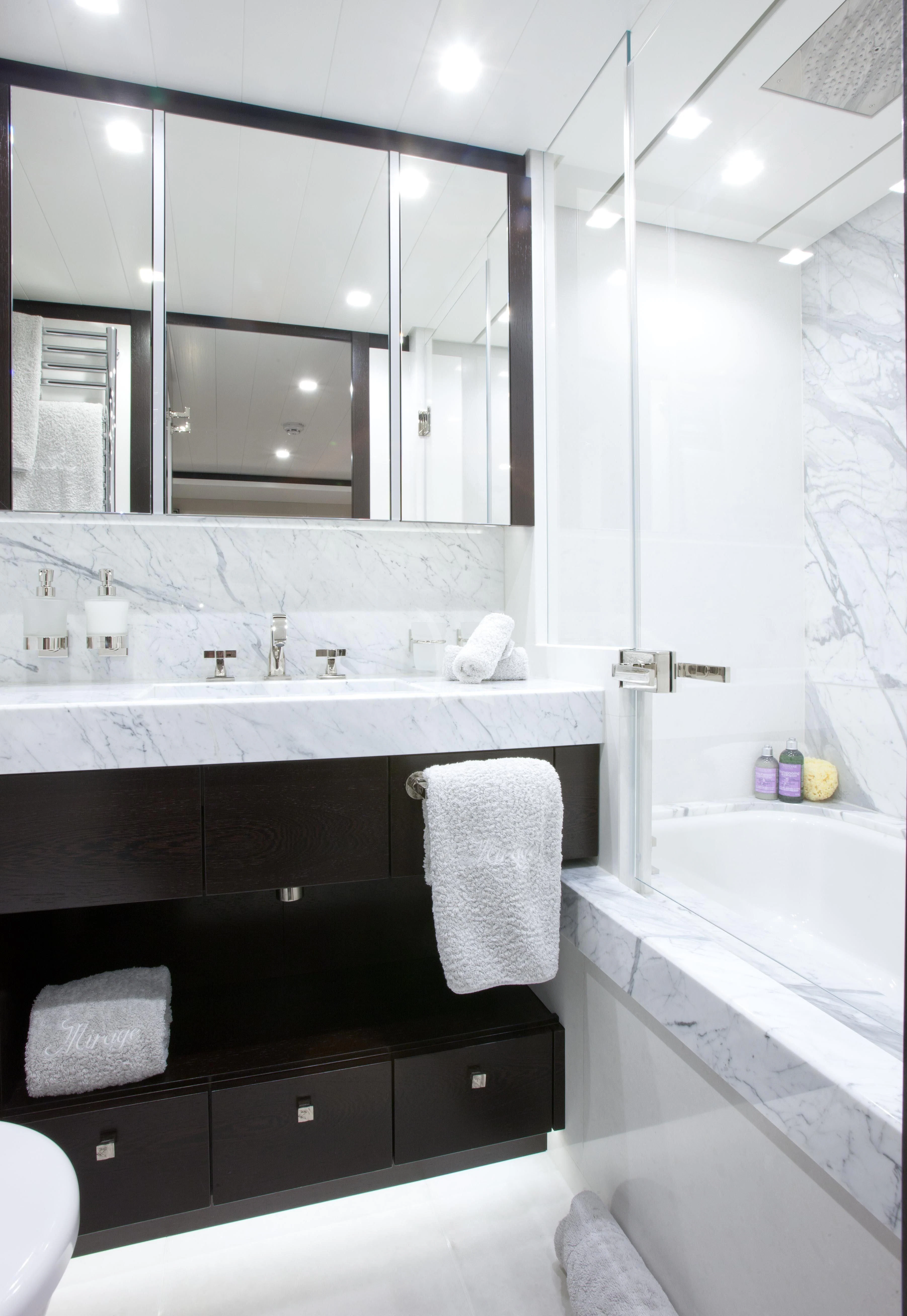 a bathroom with a large mirror aboard MIRAGE Yacht for Sale
