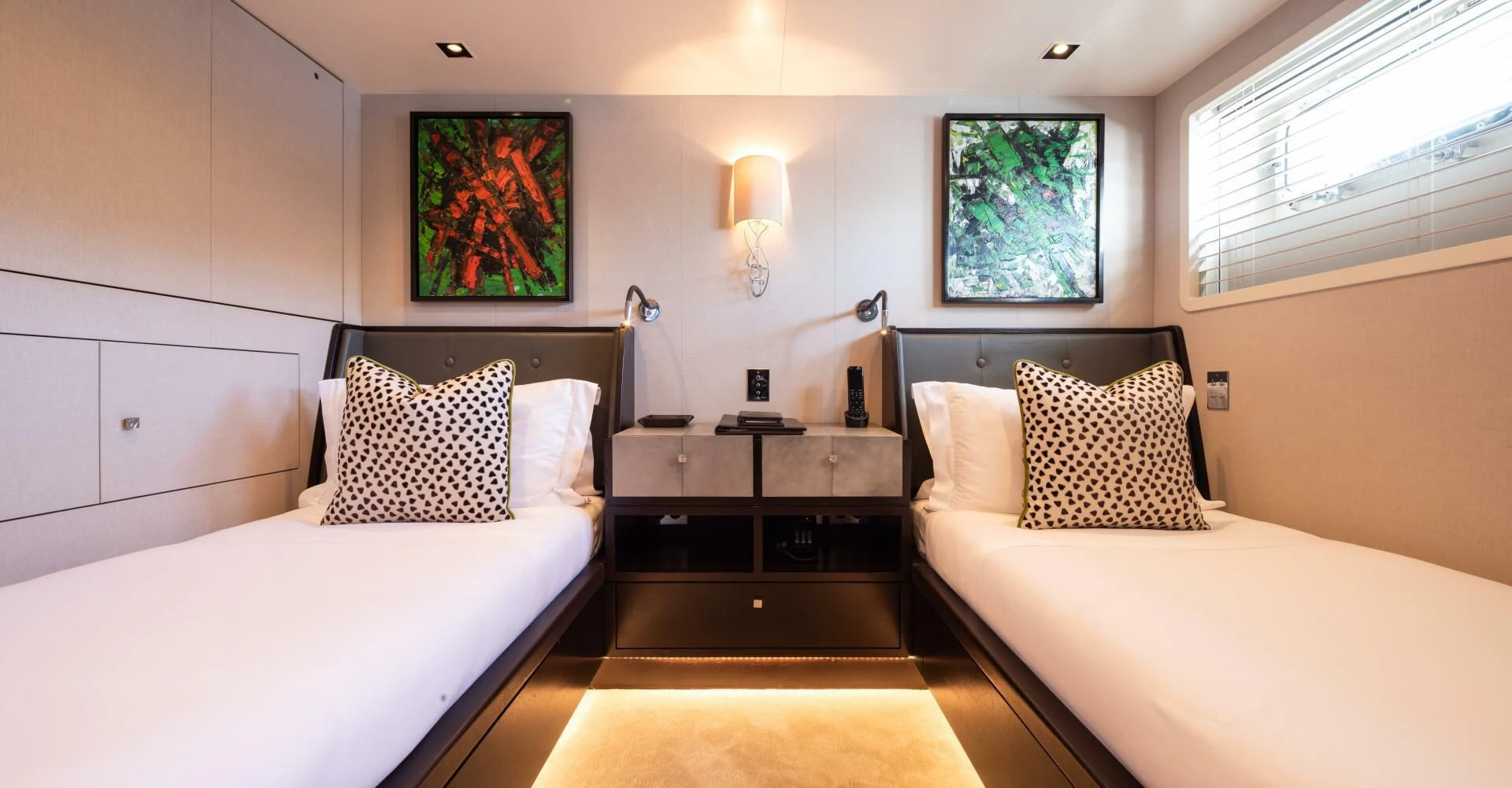 a room with two beds aboard MIRAGE Yacht for Sale