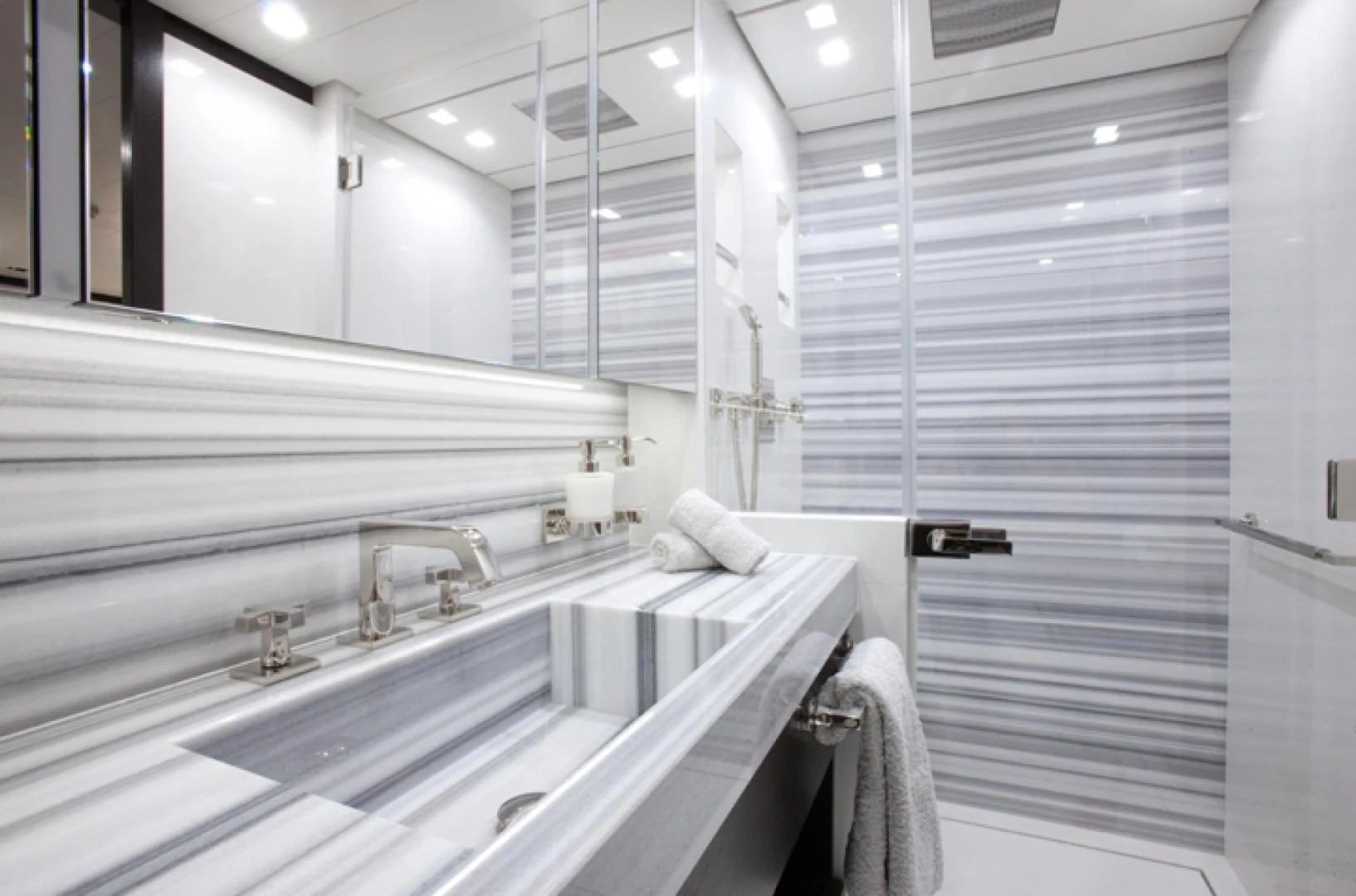 a bathroom with a large countertop aboard MIRAGE Yacht for Sale
