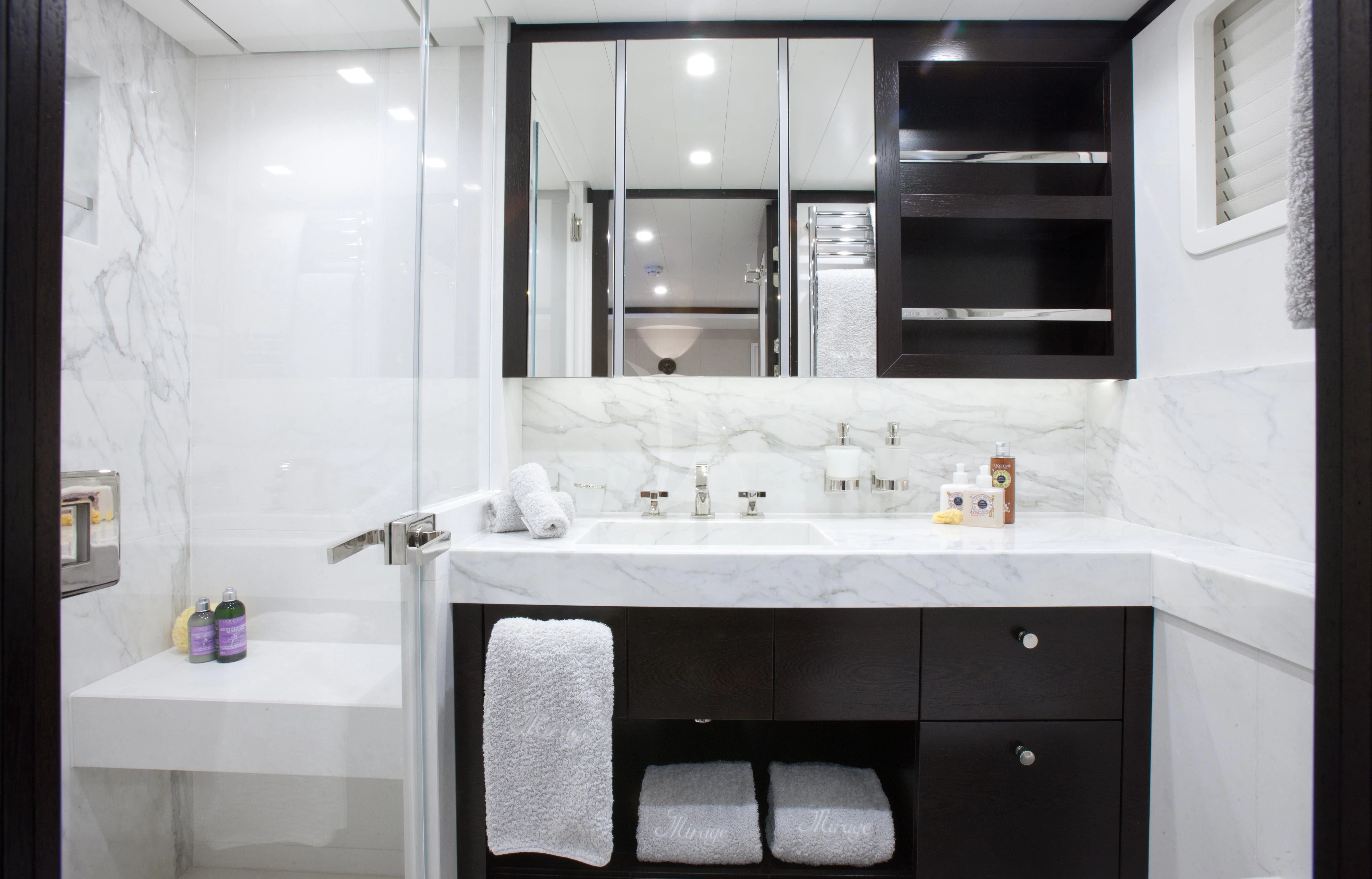 a bathroom with a sink and mirror aboard MIRAGE Yacht for Sale