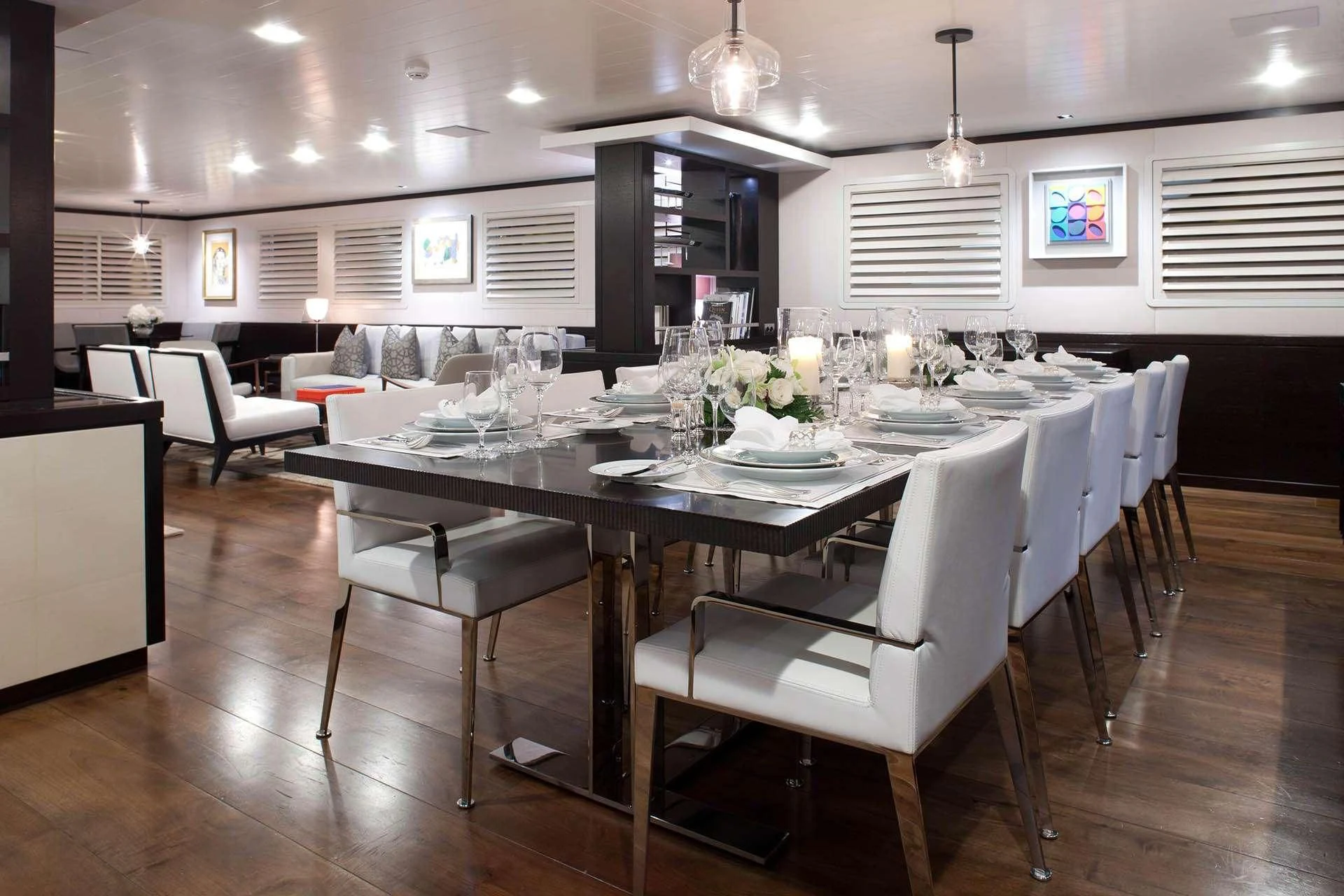 a large kitchen with a table and chairs aboard MIRAGE Yacht for Sale