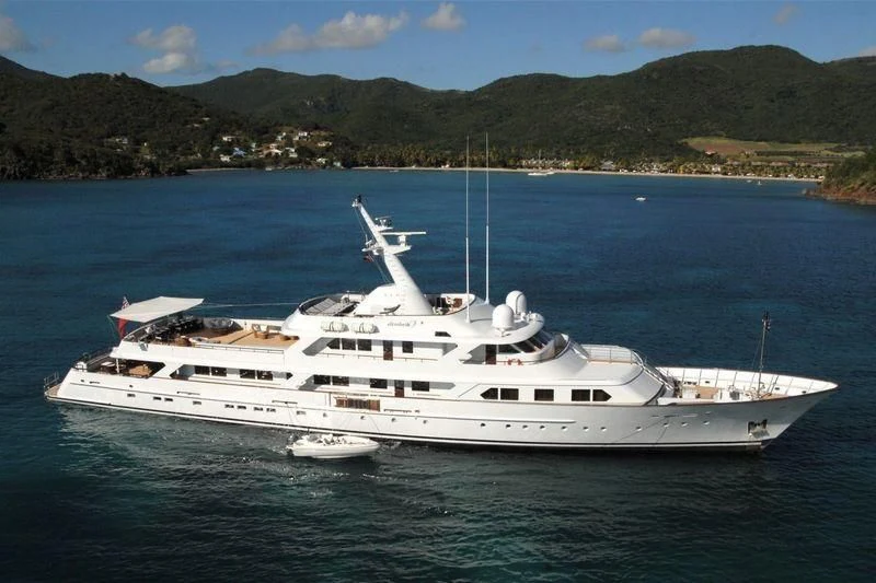 a white yacht in the water aboard MIRAGE Yacht for Sale