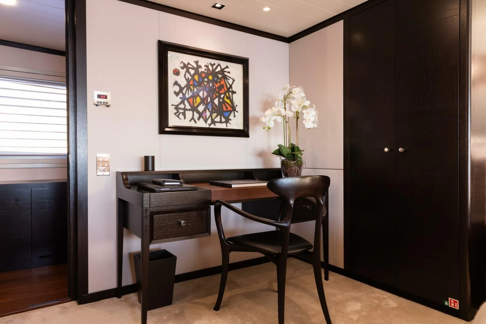 a desk and chair in a room aboard MIRAGE Yacht for Sale