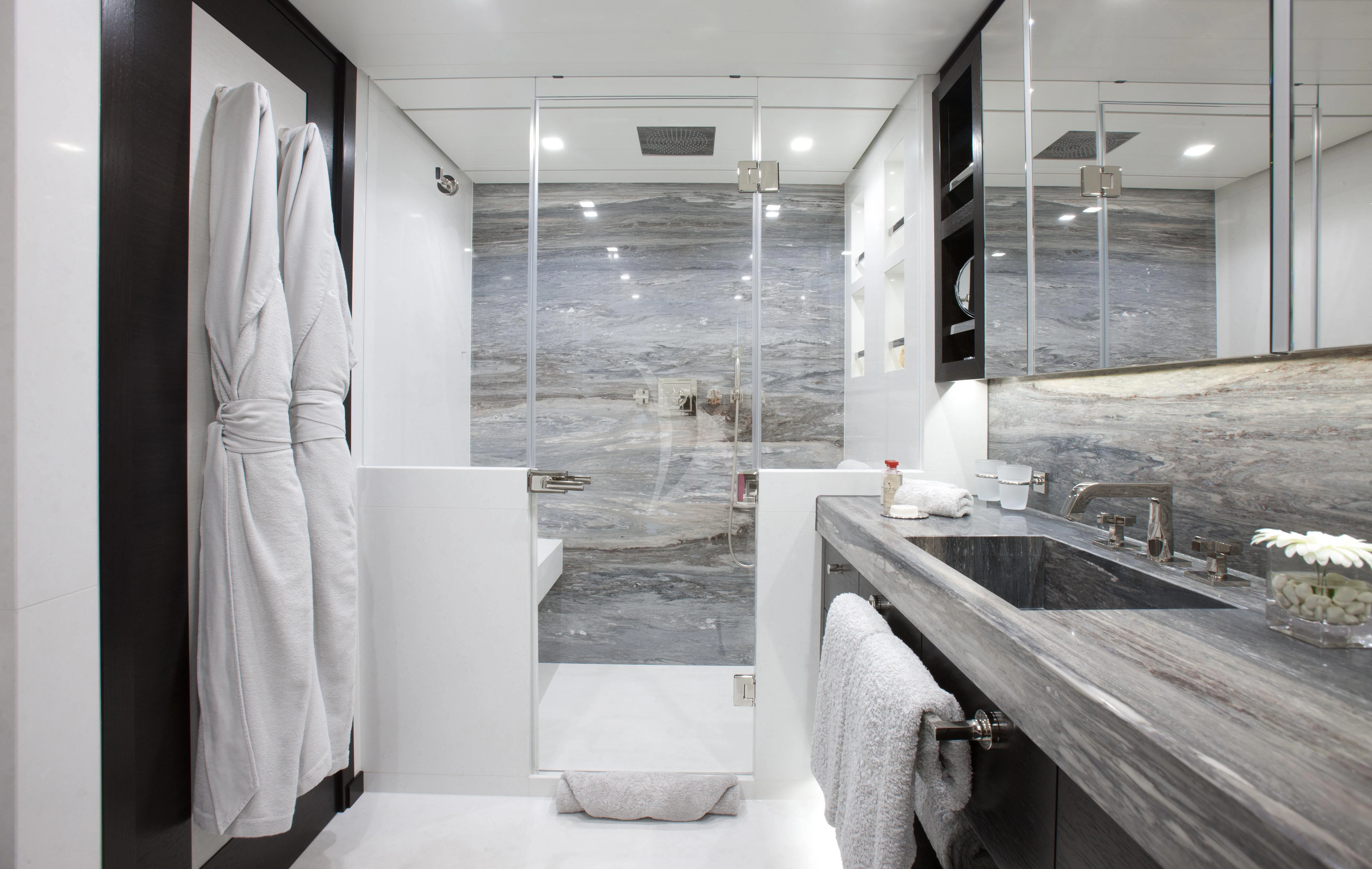 a bathroom with a large mirror aboard MIRAGE Yacht for Sale