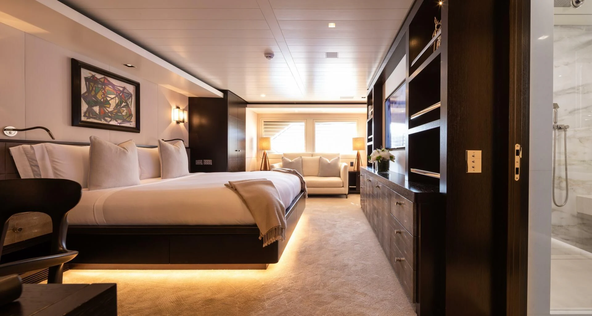 a large bedroom with a bed aboard MIRAGE Yacht for Sale