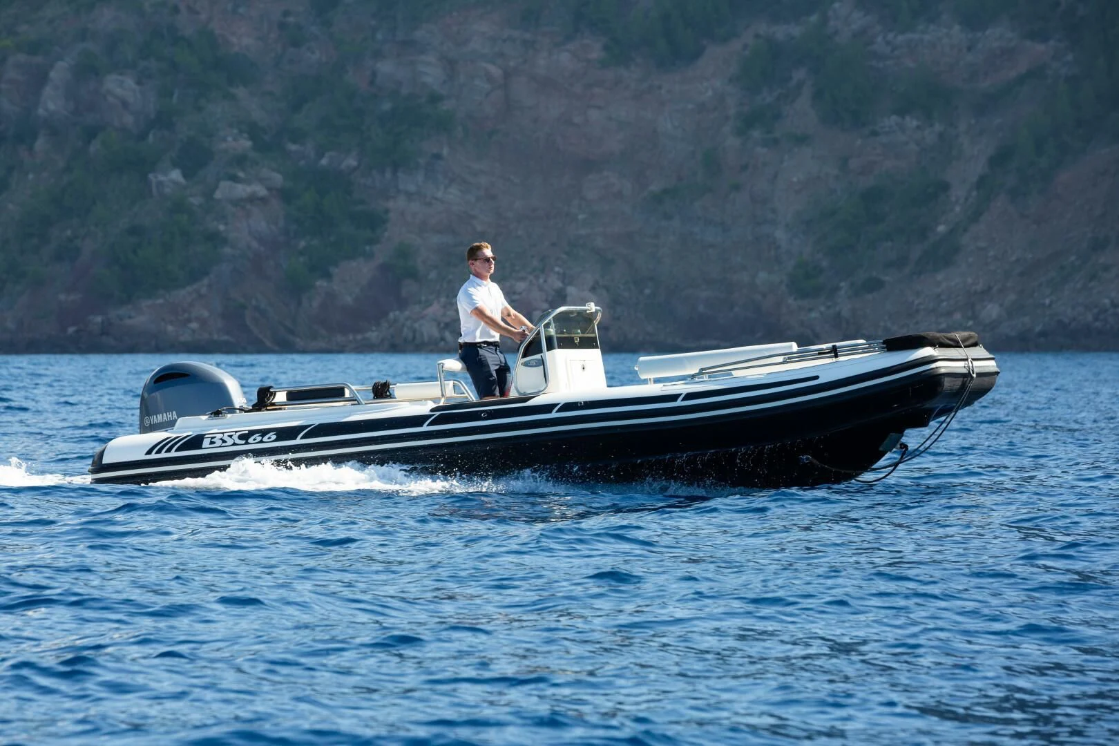 a man in a boat aboard MIRAGE Yacht for Sale