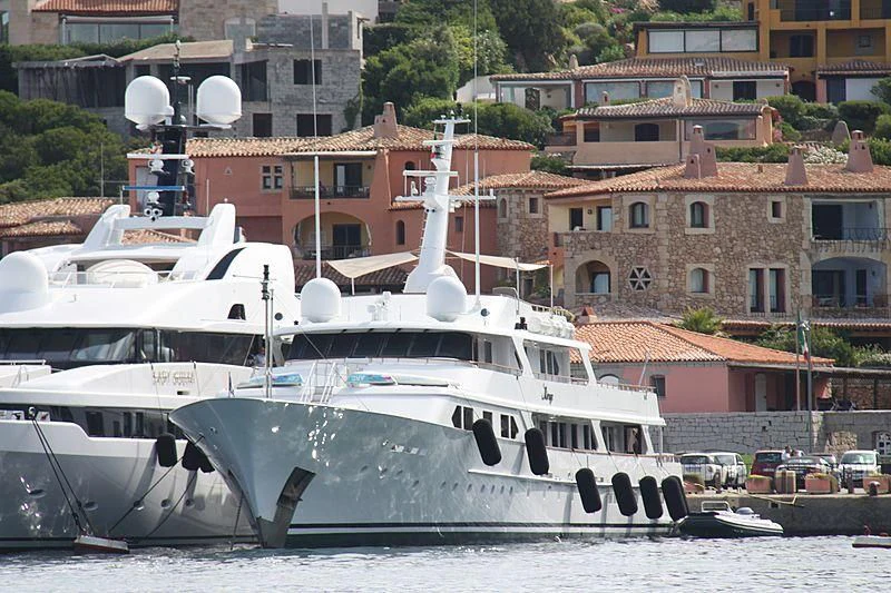 a boat docked in a harbor aboard MIRAGE Yacht for Sale