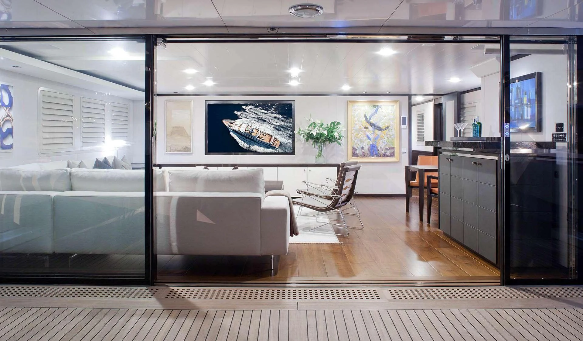 a room with a couch and a table aboard MIRAGE Yacht for Sale