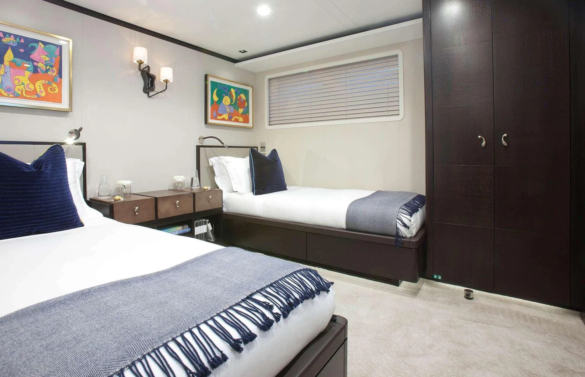 a couple of beds in a room aboard MIRAGE Yacht for Sale