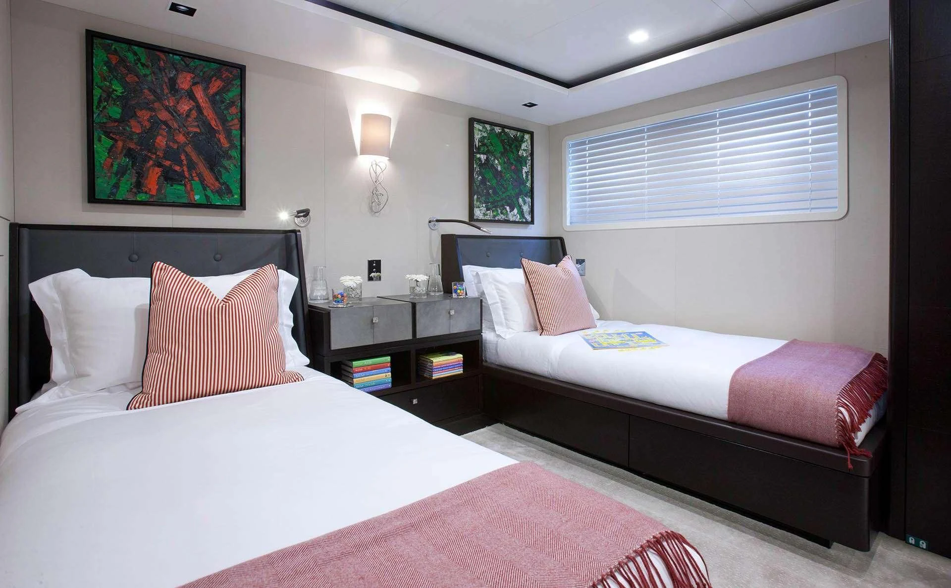 a couple of beds in a hotel room aboard MIRAGE Yacht for Sale