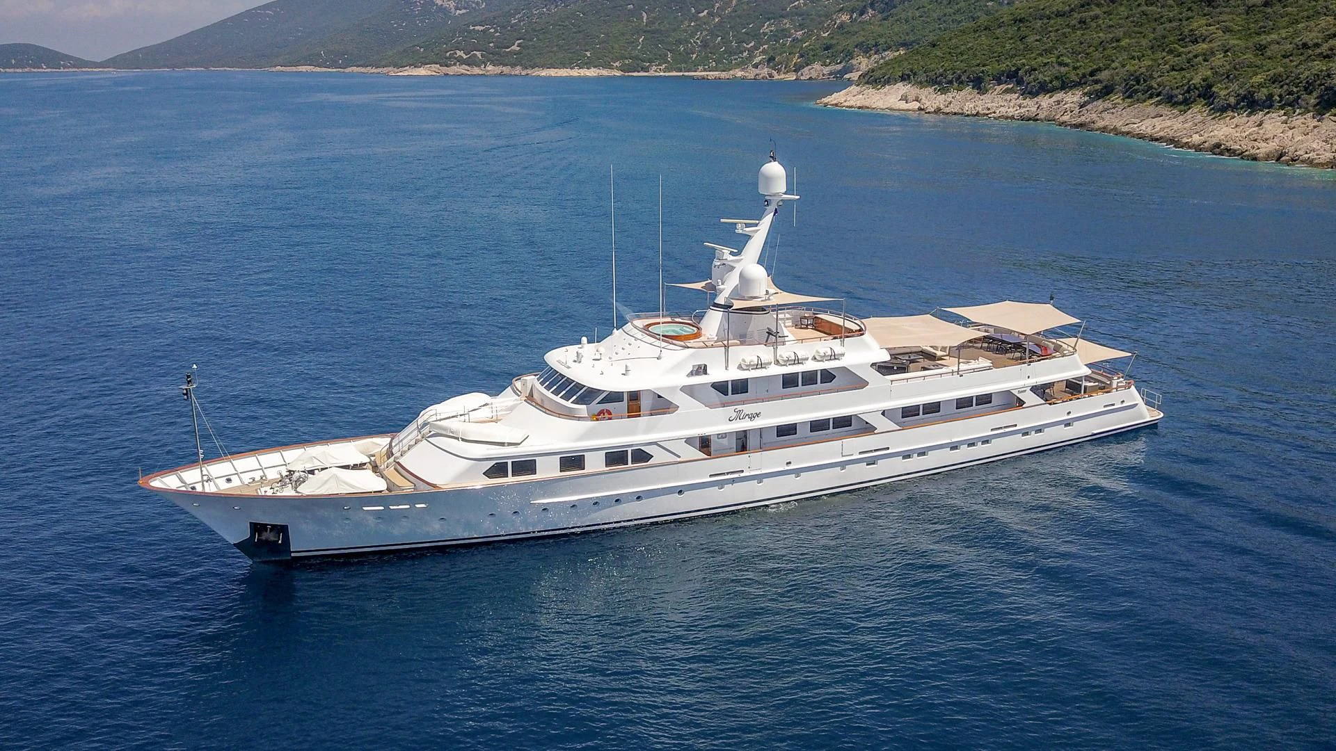 a white boat in the water aboard MIRAGE Yacht for Sale