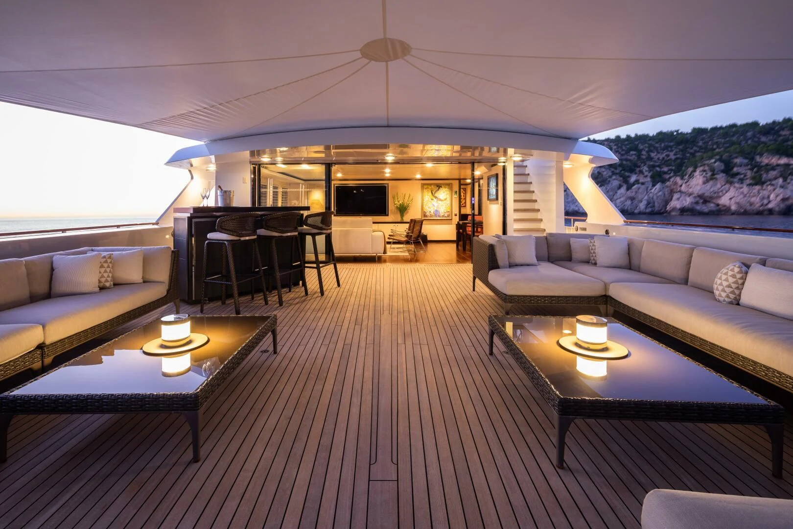 a living room with a couch and a table aboard MIRAGE Yacht for Sale