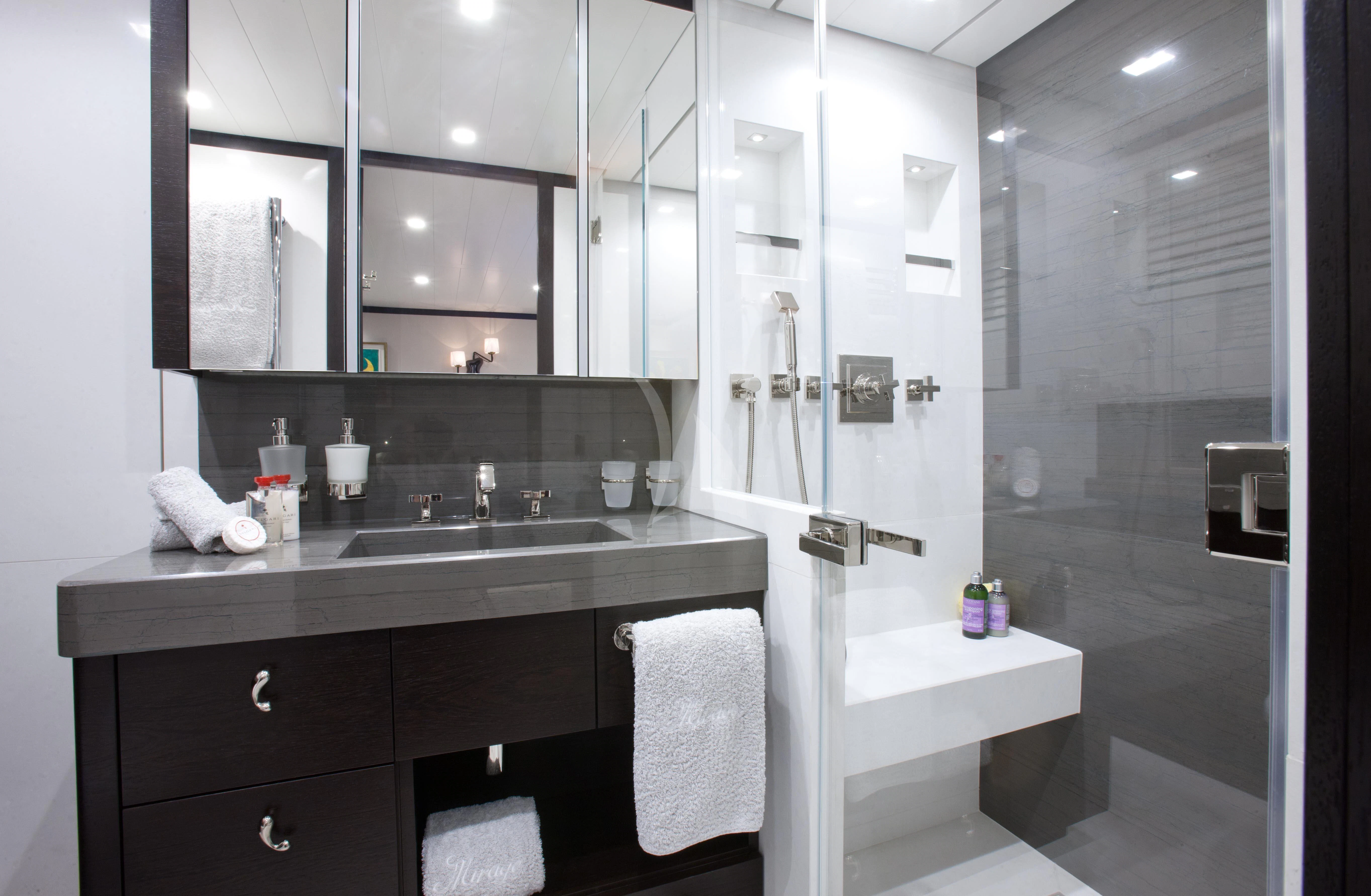 a bathroom with a sink and a shower aboard MIRAGE Yacht for Sale