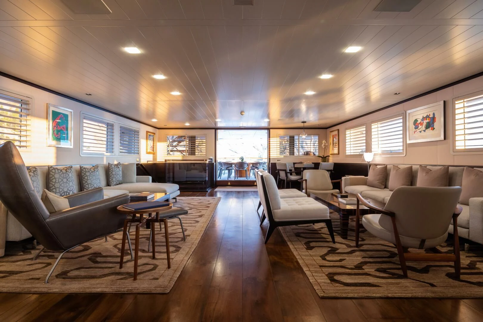 a living room with a couch and a table aboard MIRAGE Yacht for Sale