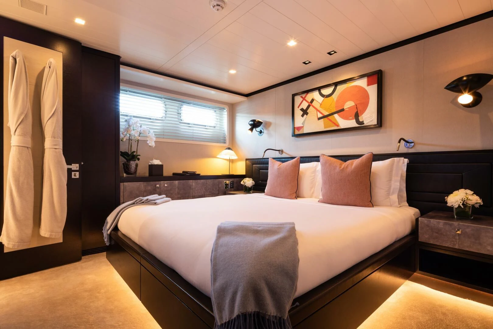 a large bed in a room aboard MIRAGE Yacht for Sale