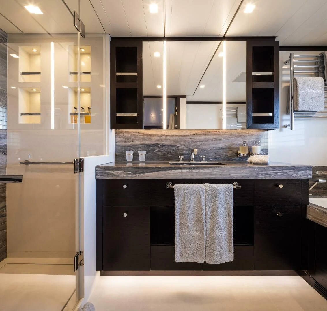 a kitchen with a white refrigerator aboard MIRAGE Yacht for Sale