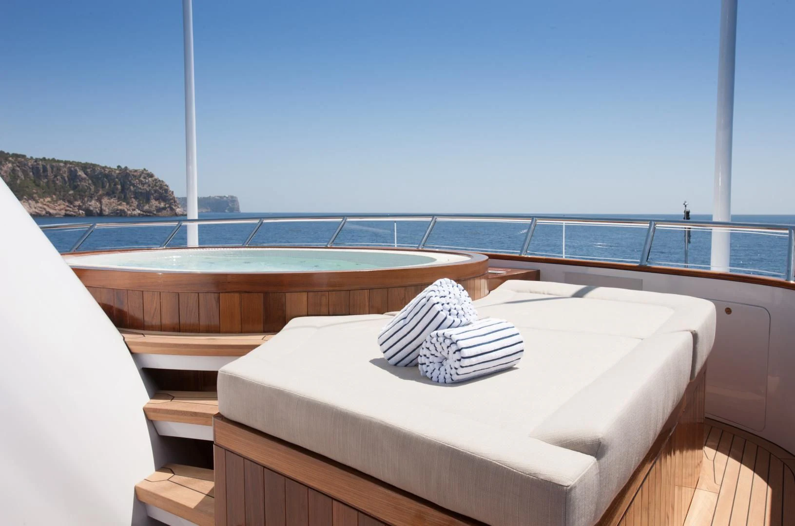 a bed on a balcony aboard MIRAGE Yacht for Sale