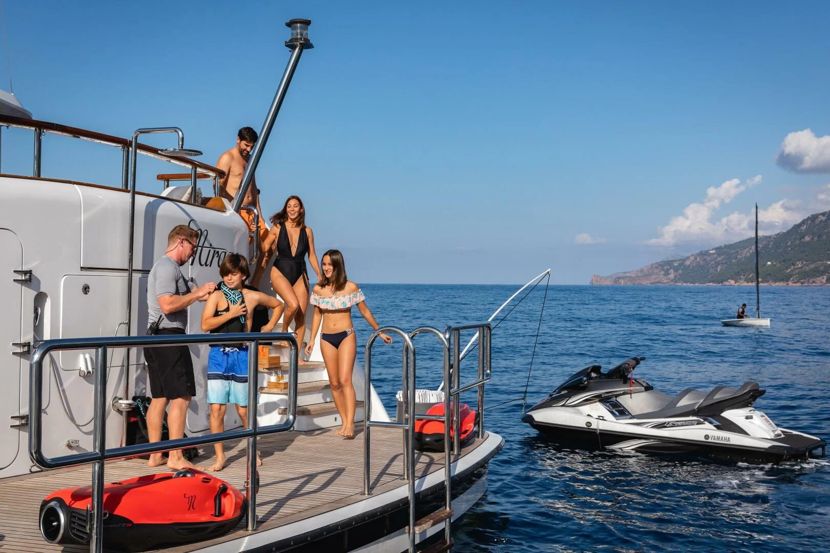 a group of people on a boat aboard MIRAGE Yacht for Sale