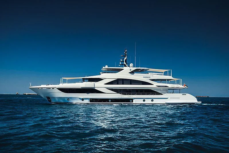 a white yacht in the water aboard NASHWAN Yacht for Sale