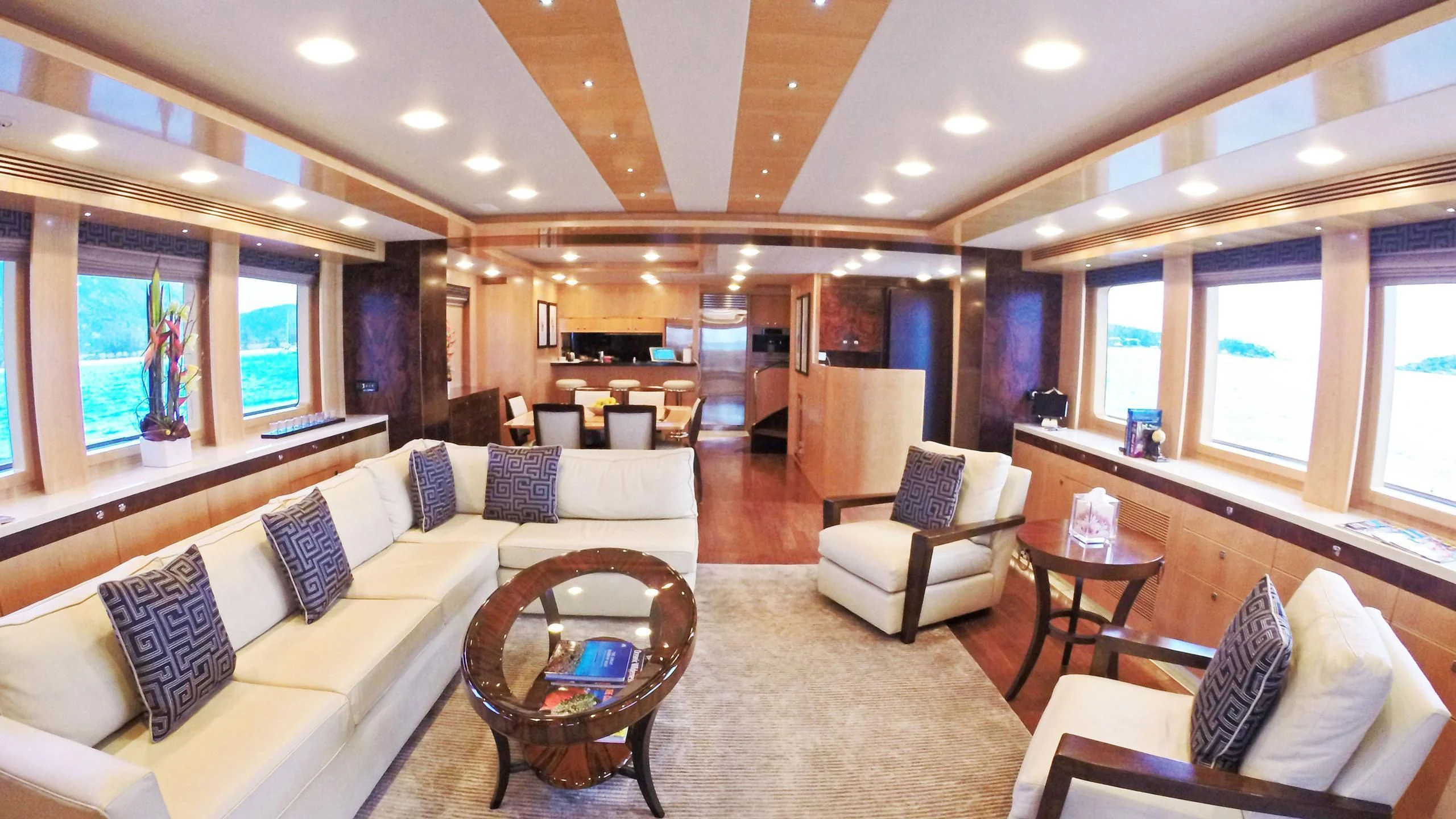 a living room with a couch and a table aboard SALVATORE II Yacht for Sale