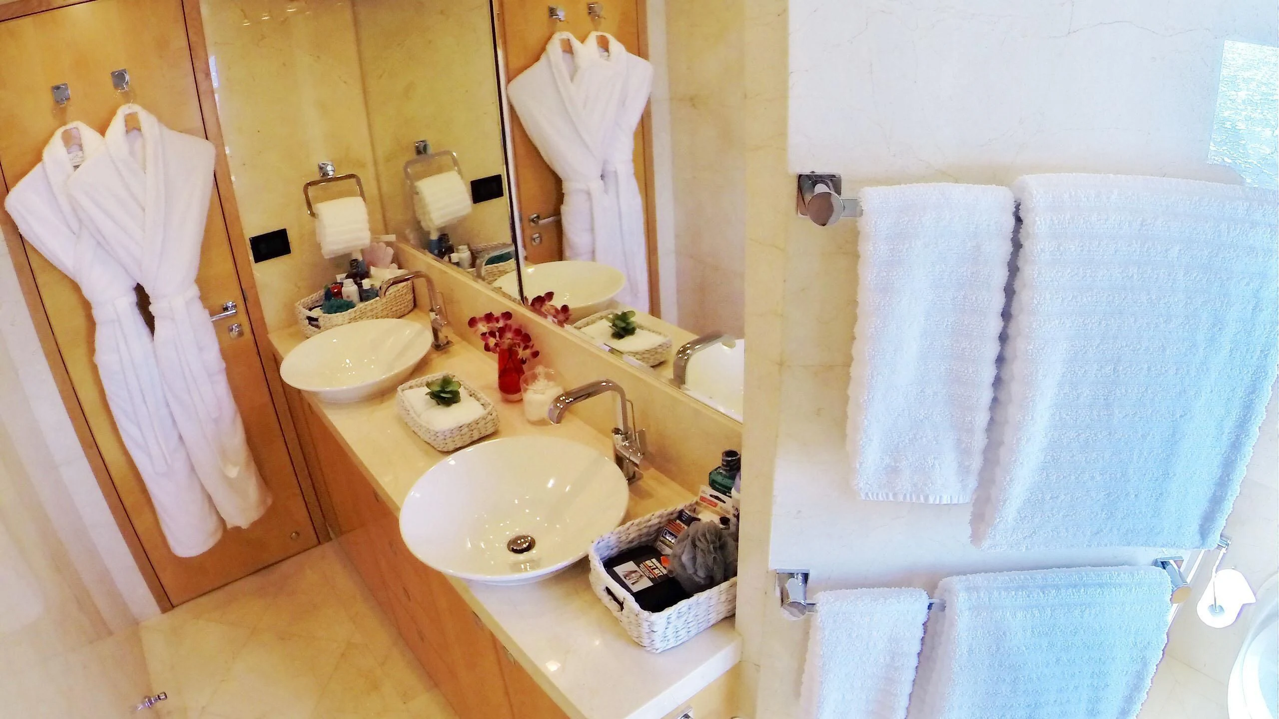 a bathroom with a sink and towels aboard SALVATORE II Yacht for Sale