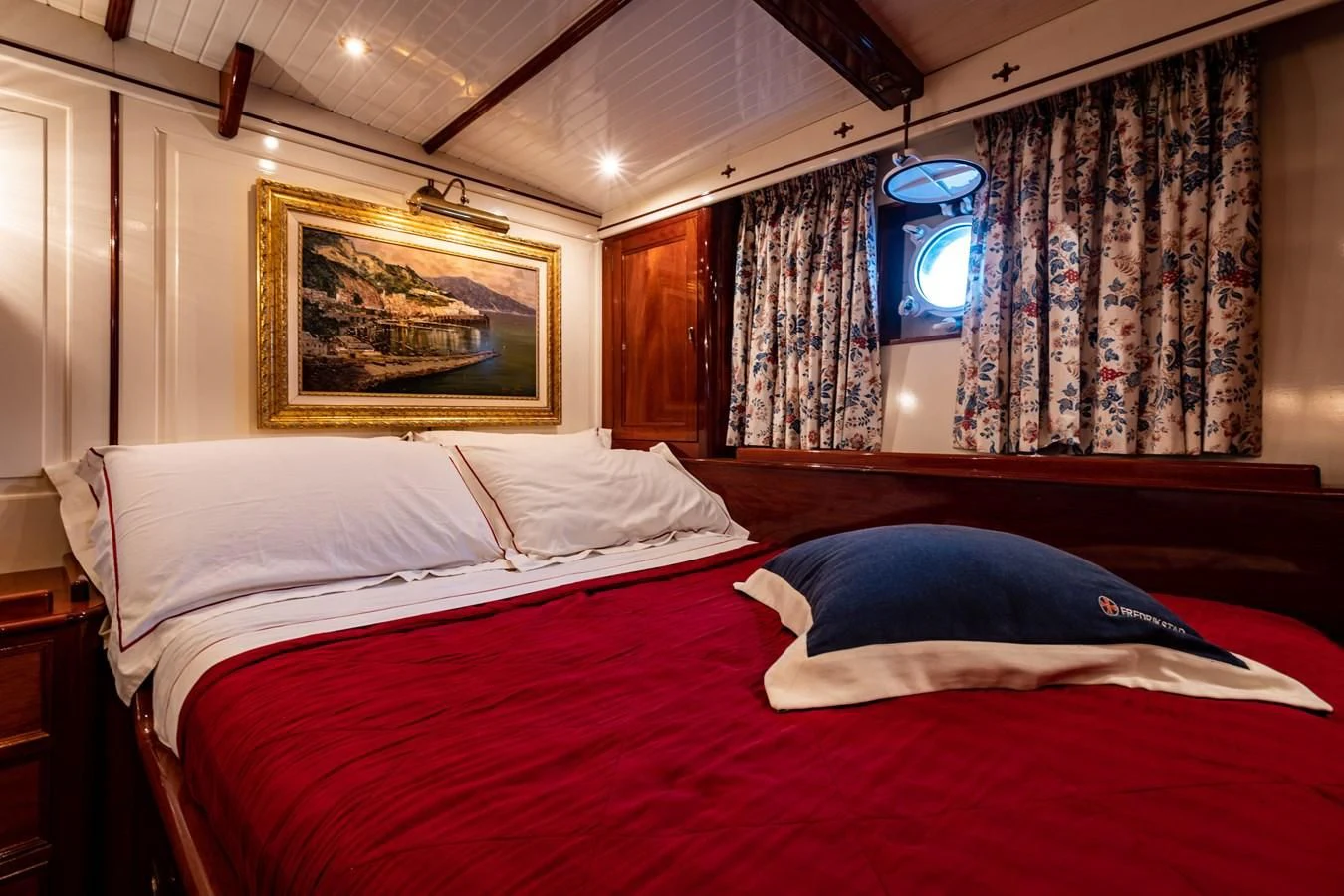 a room with a bed and a painting on the wall aboard FREDRIKSTAD Yacht for Sale