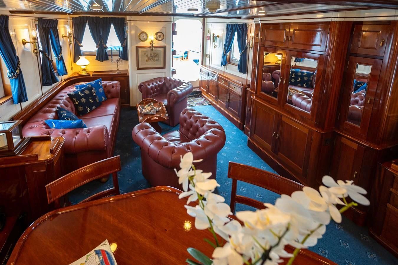 a room with a couch and a table aboard FREDRIKSTAD Yacht for Sale