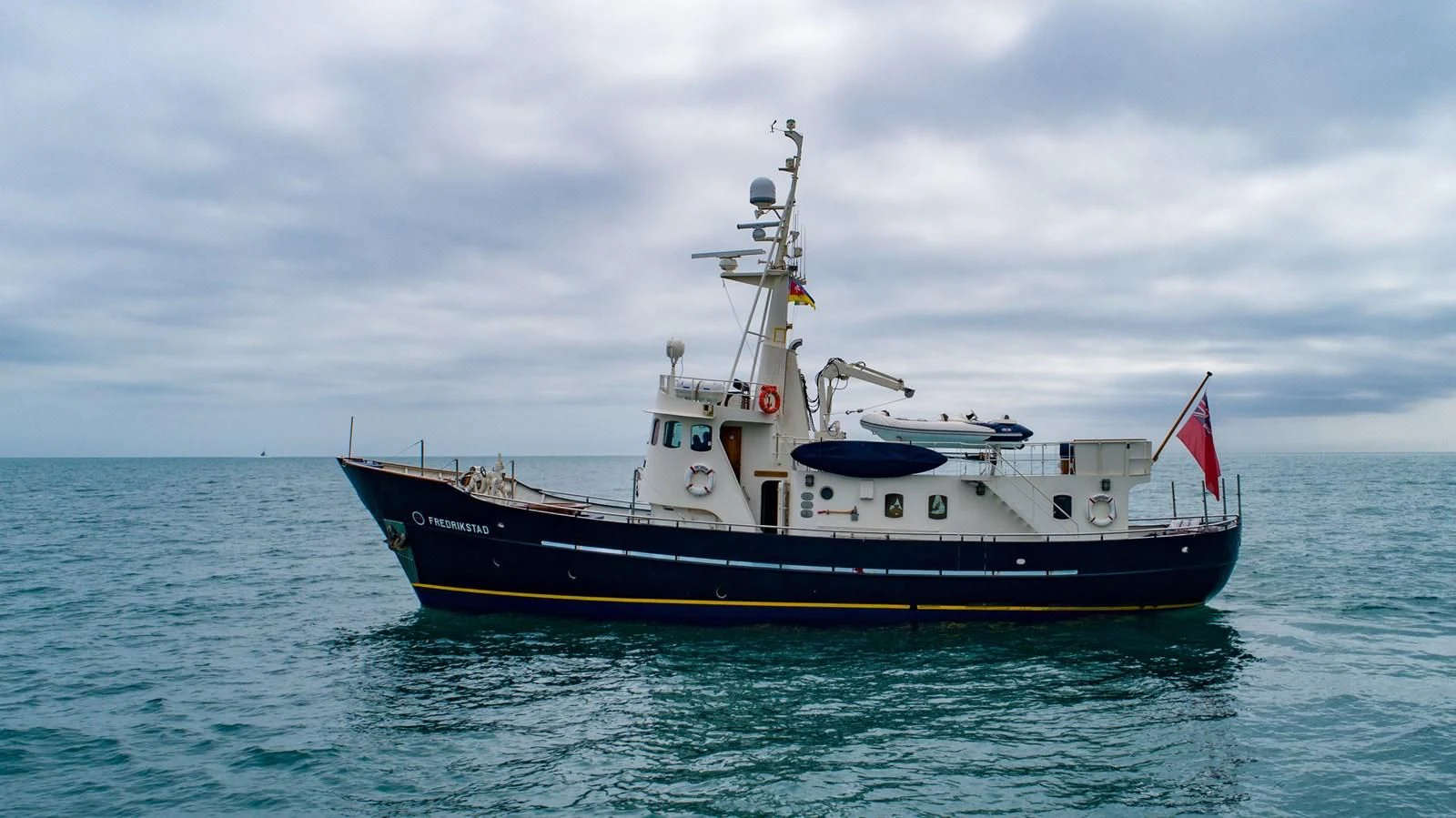 a large ship in the water aboard FREDRIKSTAD Yacht for Sale