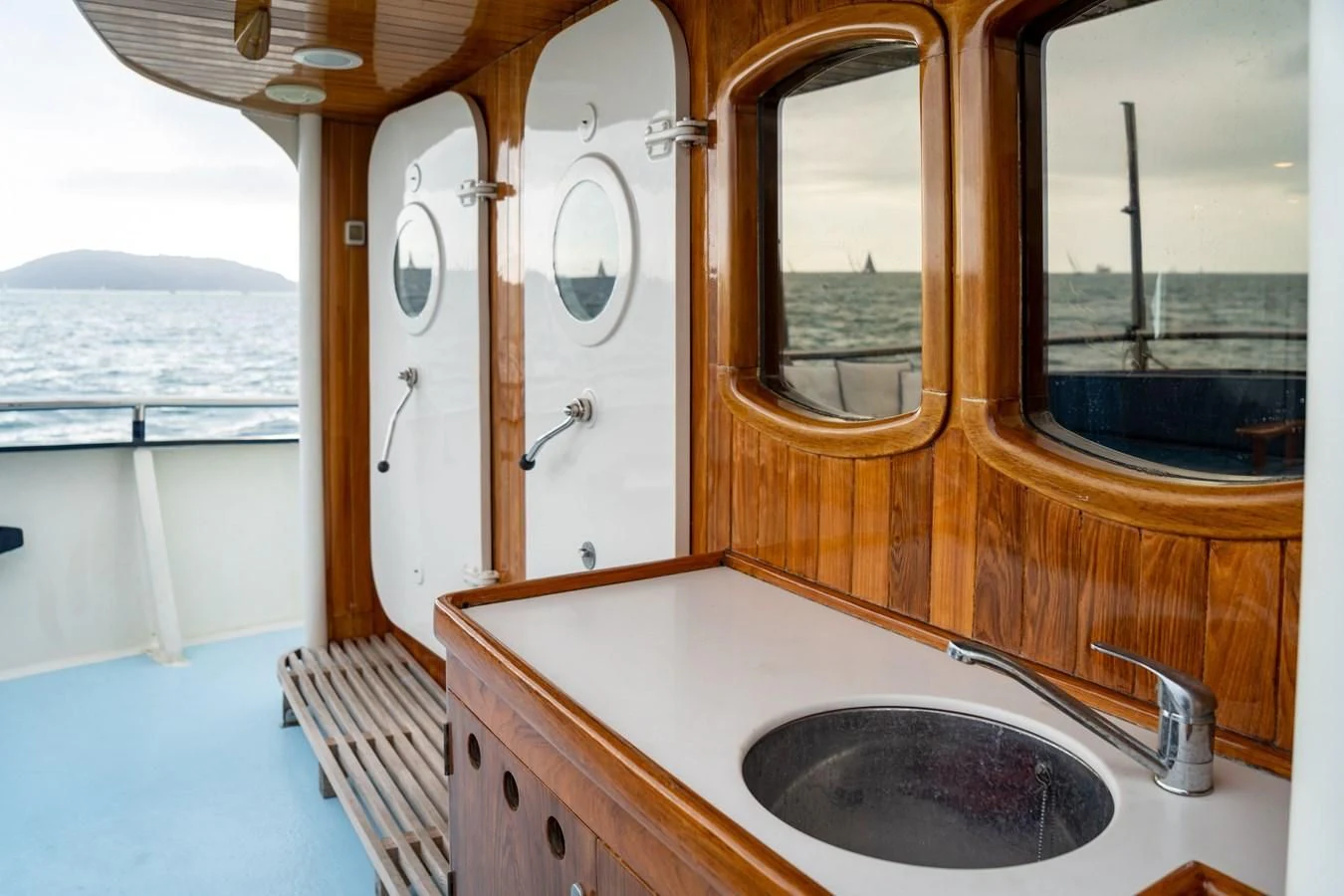a bathroom with a sink and a bathtub aboard FREDRIKSTAD Yacht for Sale
