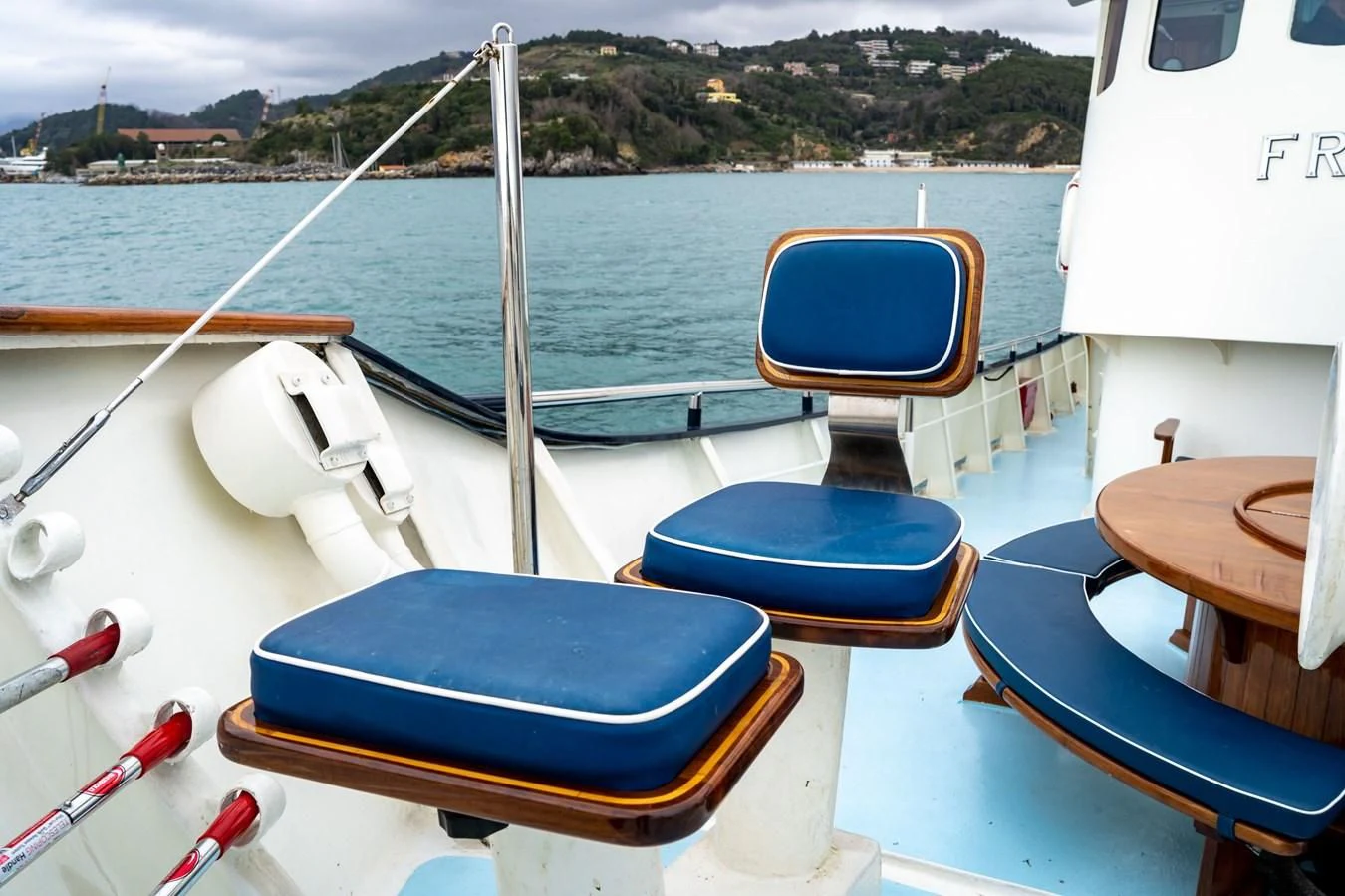 a boat with a seat on the water aboard FREDRIKSTAD Yacht for Sale