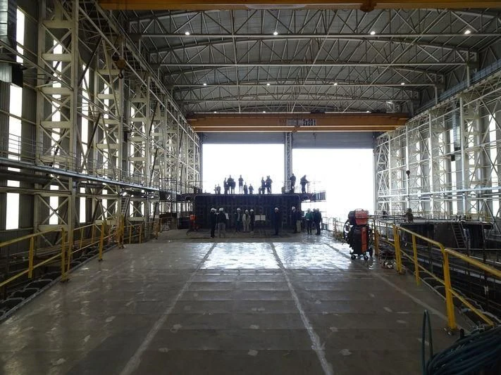 a large room with many people in it aboard ROE Yacht for Sale