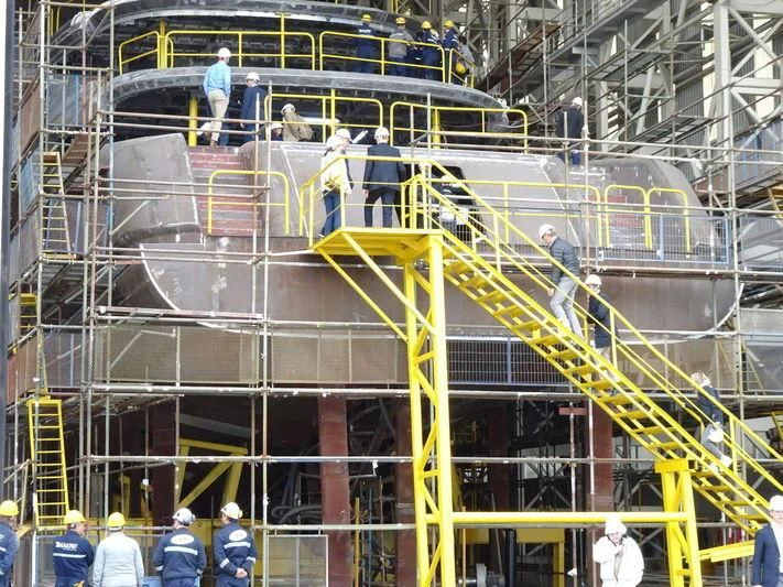 a group of people working on a building aboard ROE Yacht for Sale